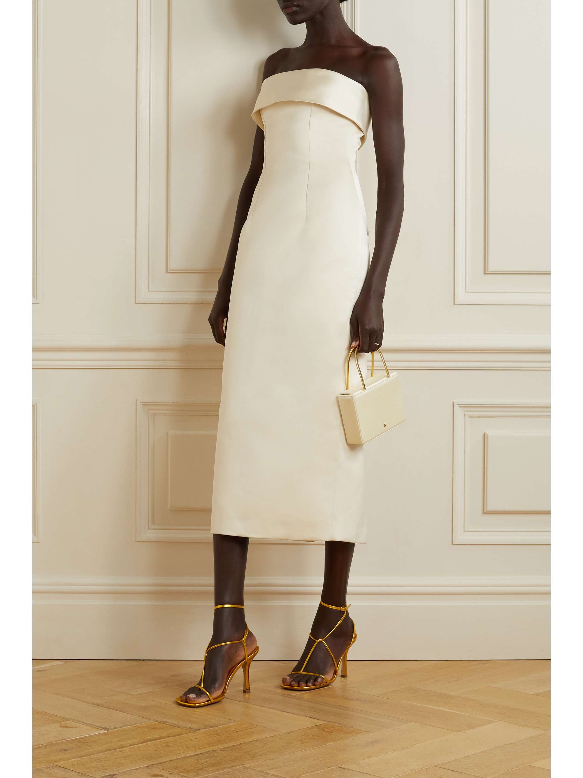 EXCLUSIVE AT NET-A-PORTER. Emilia Wickstead's streamlined 'Keeley' midi dress is ideal for any of the events leading up to your big day, including your shower or rehearsal dinner. It's cut for a close fit from ivory duchesse-satin with front darts and a fold-over strapless neckline. Wear it with statement heels.
