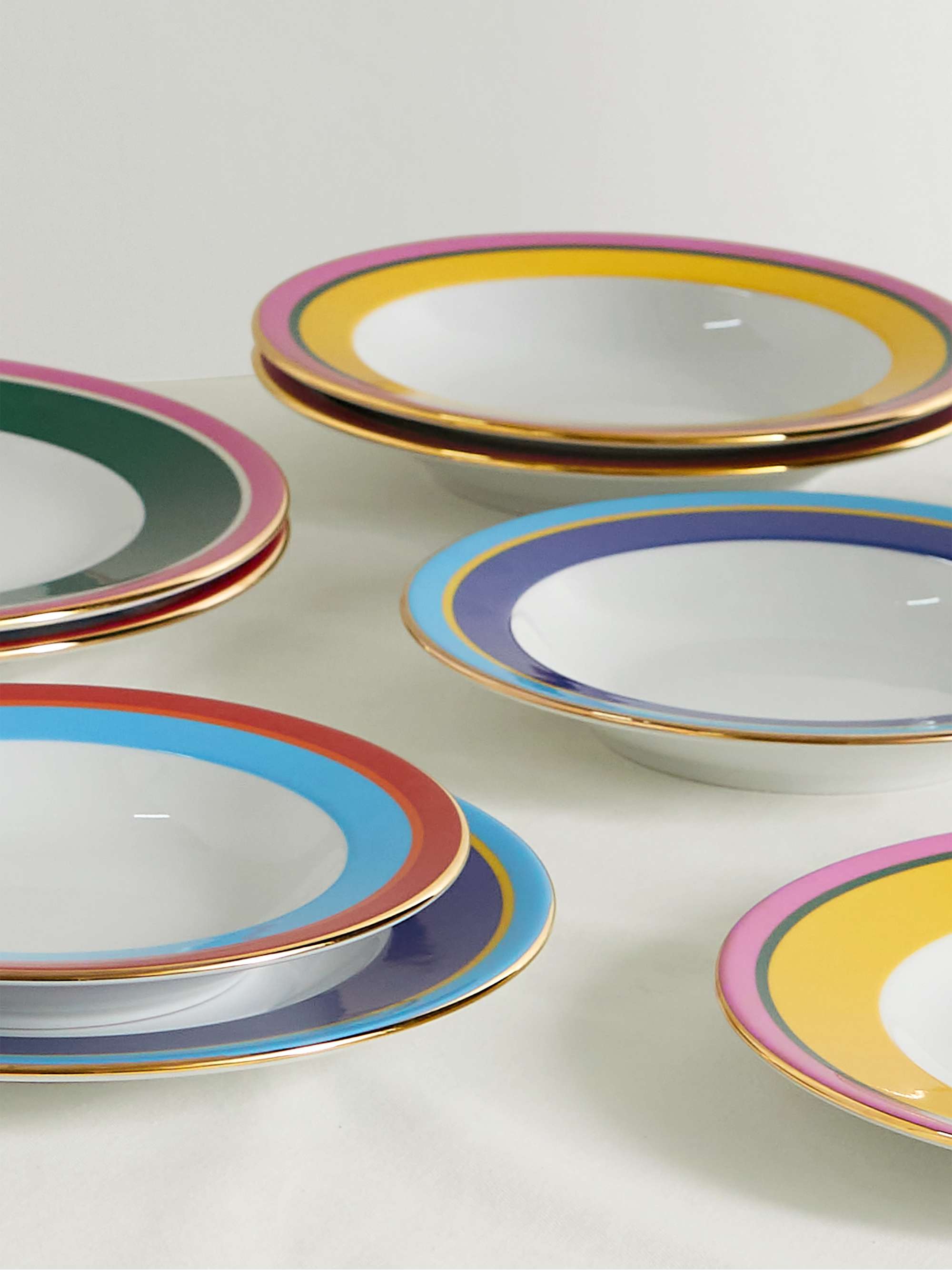 LA DOUBLEJ Set of eight gold-plated porcelain soup bowls and dinner plates