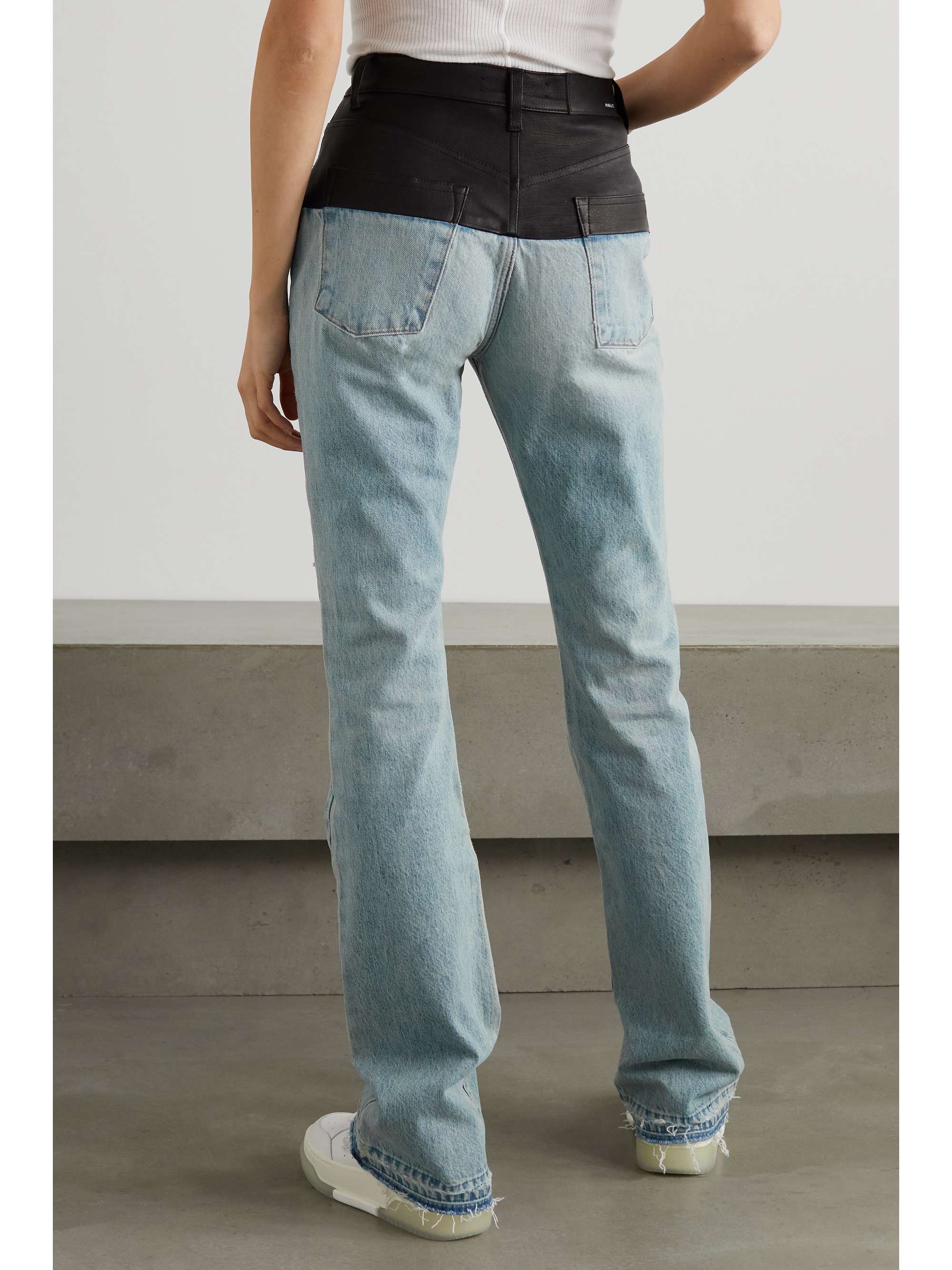 AMIRI Leather-paneled distressed denim high-rise slim-leg jeans