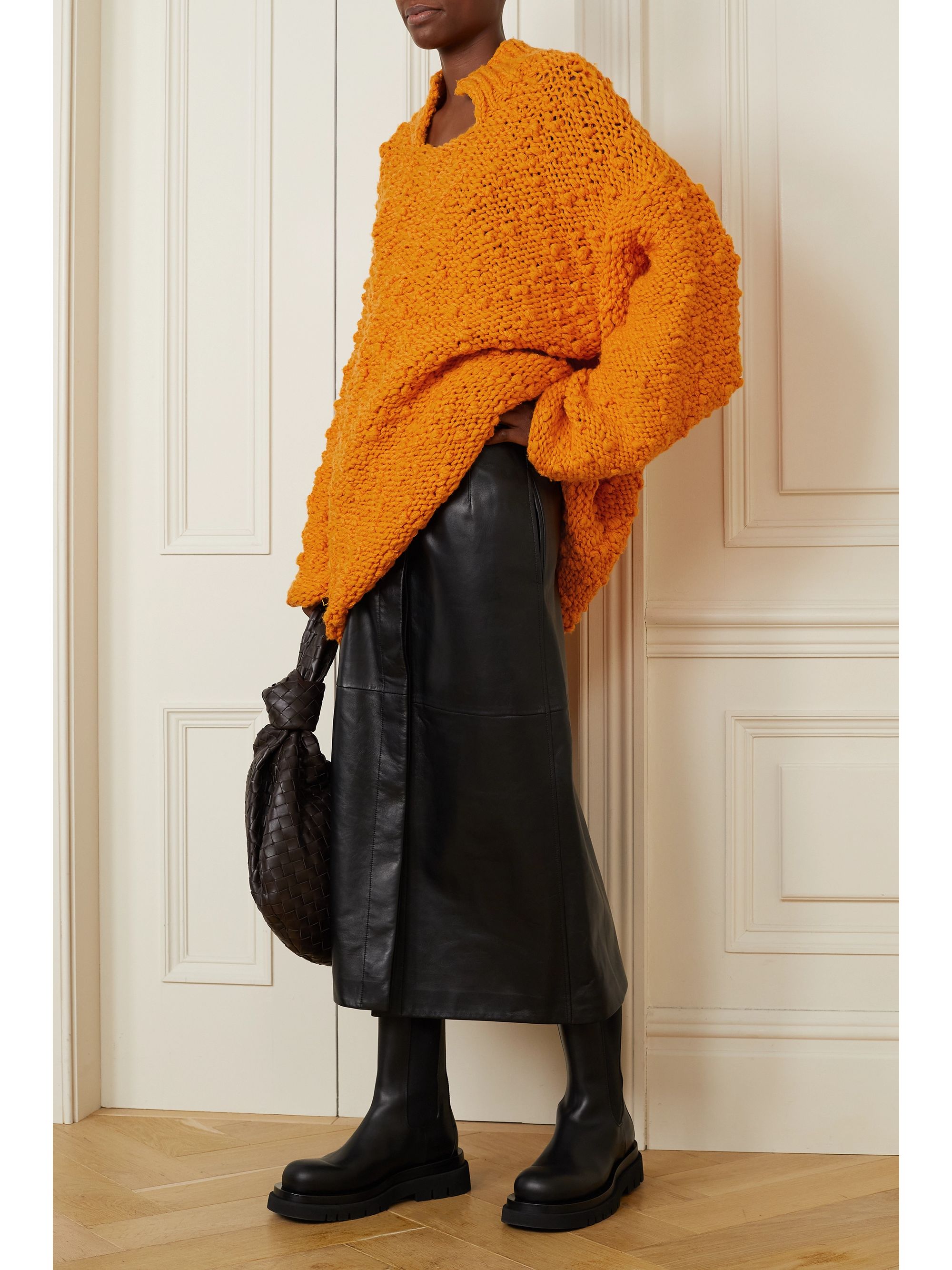 PROENZA SCHOULER Oversized orange wool sweater with textured bobble knit effect, drop shoulder and long voluminous cocoon sleeves. Open neck with stand-up collar. 