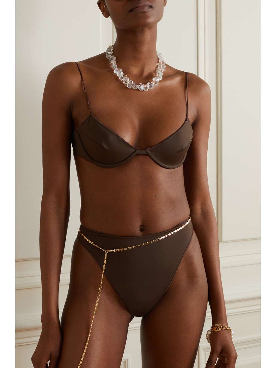 Oséree's brown bikini top is modeled after cool '90s styles. Meant to be worn with the coordinating high-rise briefs, it's made from recycled stretch fabric and has pin-thin shoulder straps and underwired balconette cups.