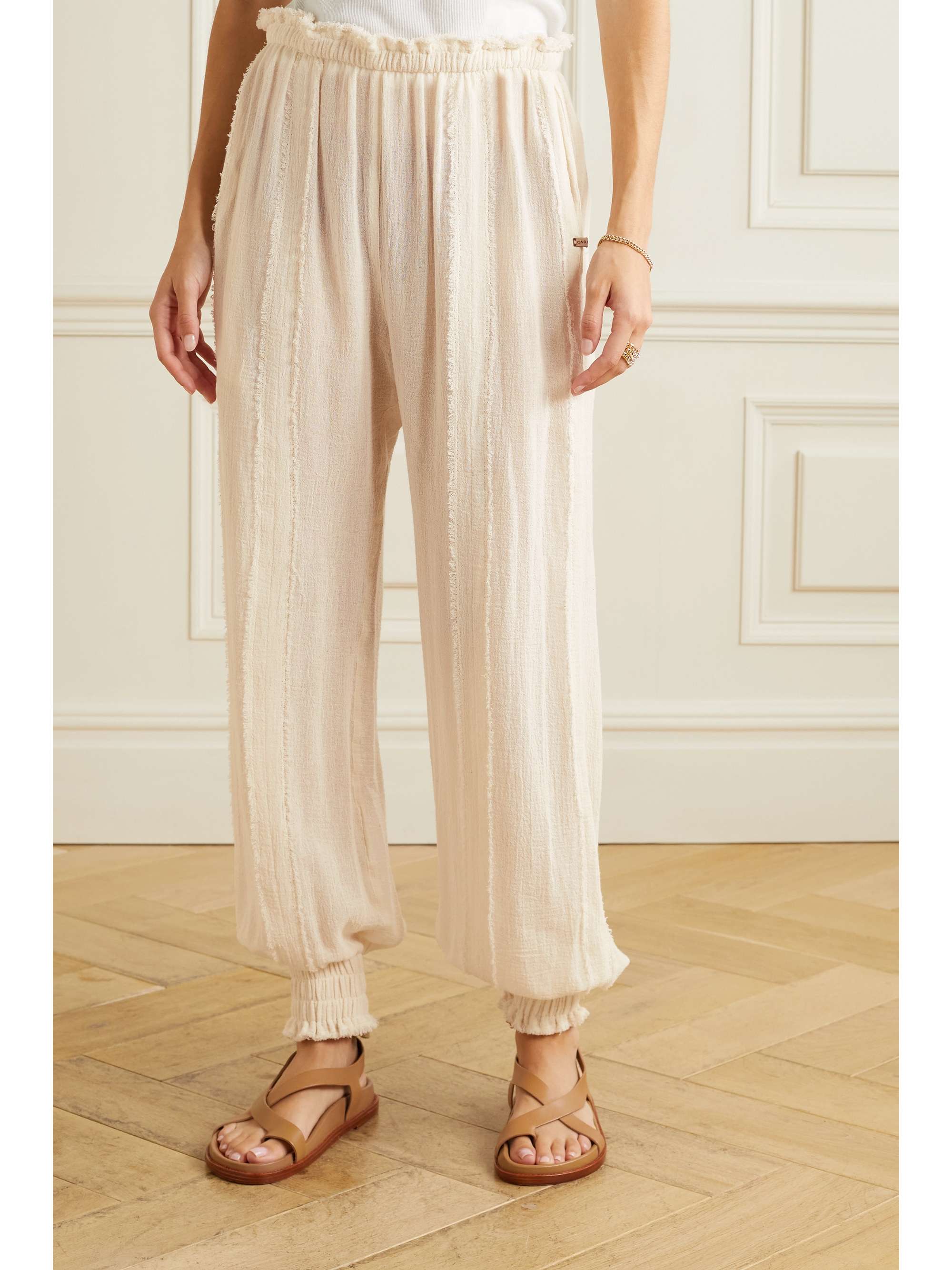 CARAVANA Sibinche frayed cotton-gauze track pants