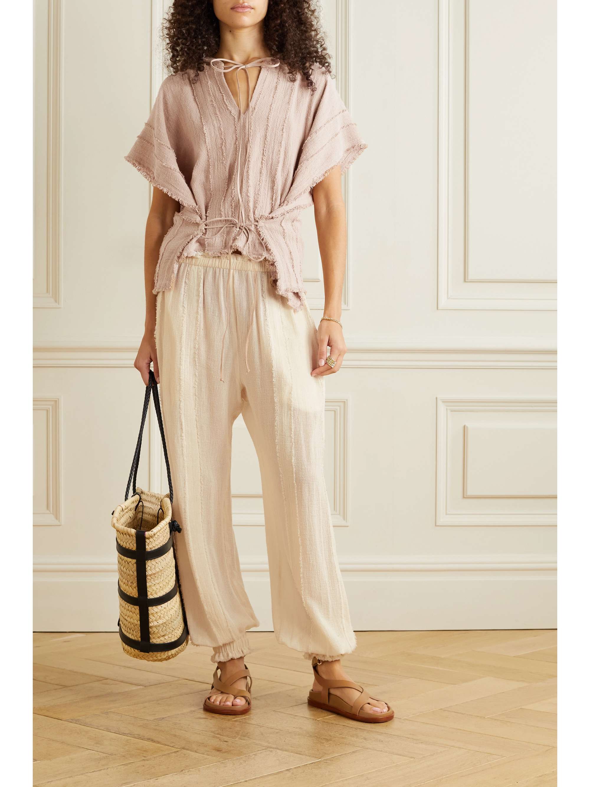 CARAVANA Sibinche frayed cotton-gauze track pants