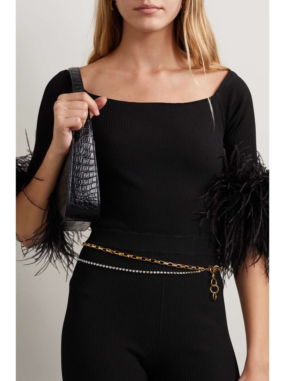 SAINT LAURENT gold and rhinestone double-layer delicate chain belt reminiscent of a fabulous necklace. Made in Italy from gold-tone chain links and embellished with crystals, it has a T-bar fastening. 