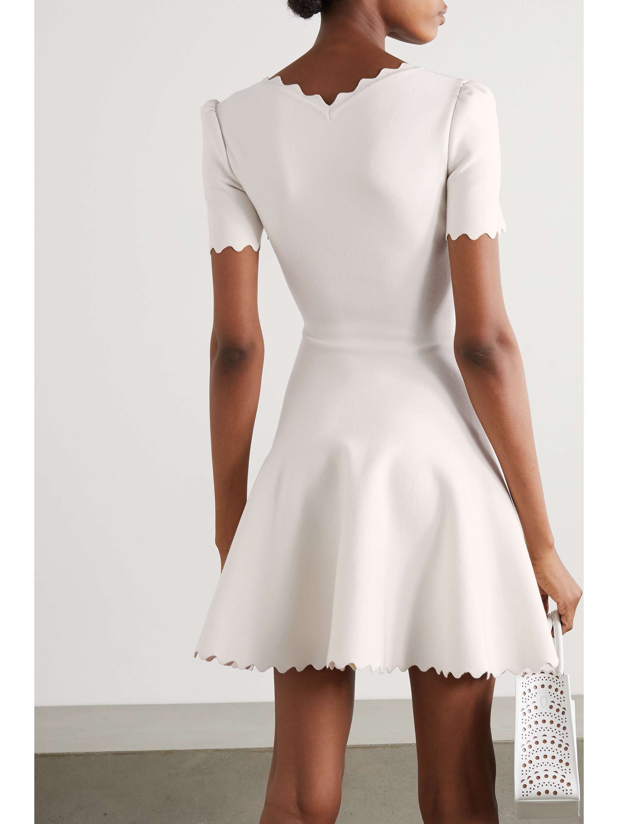 ALAÏA Scalloped stretch-knit mini dress