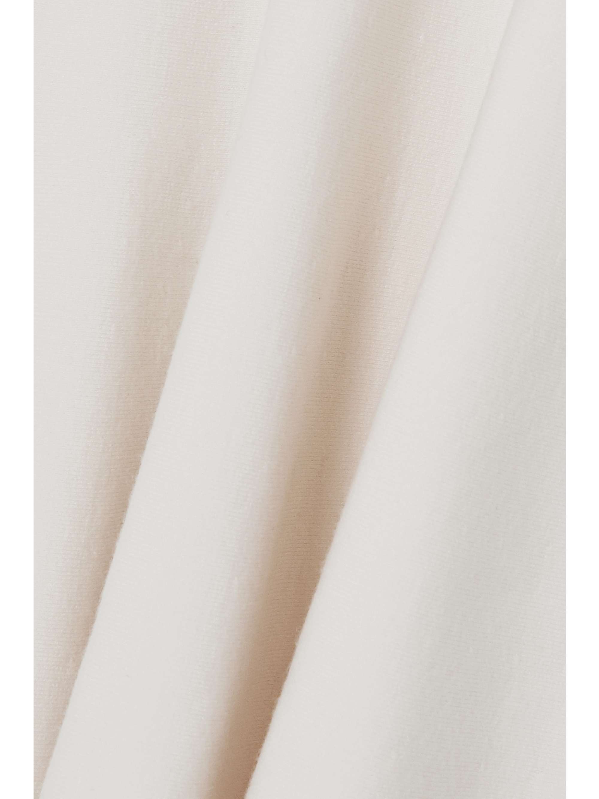 ALAÏA Scalloped stretch-knit mini dress