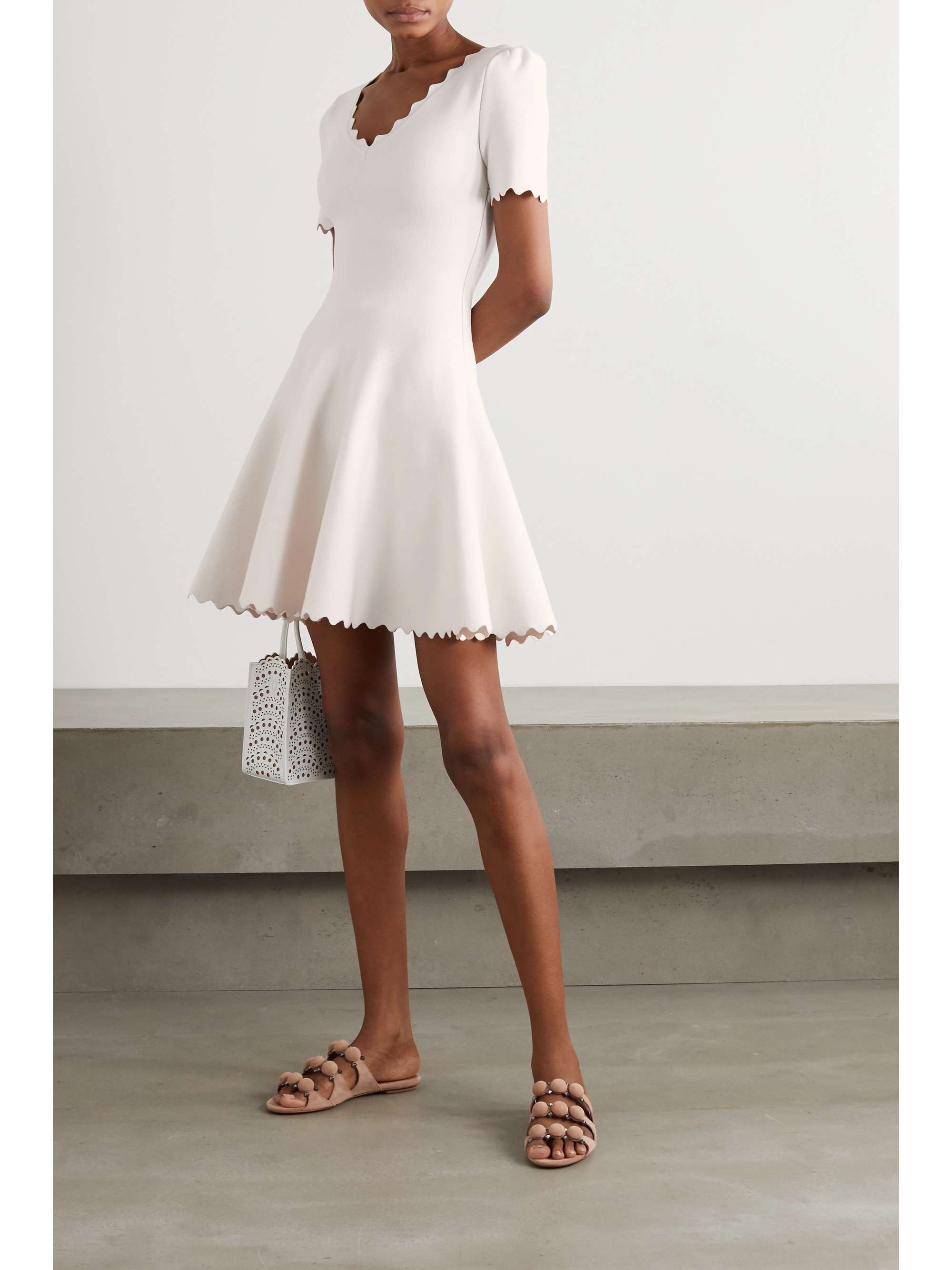 ALAÏA Scalloped stretch-knit mini dress