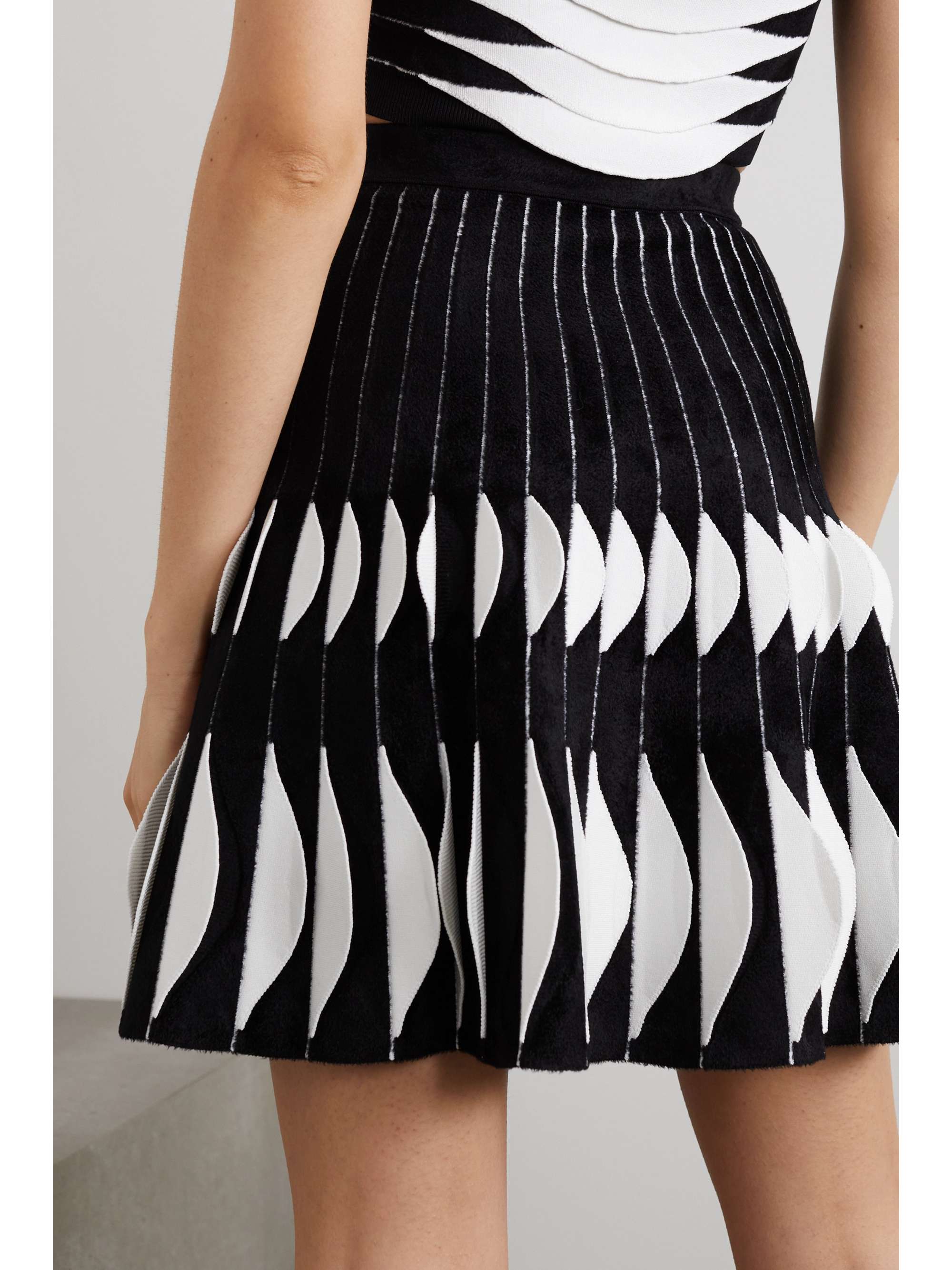 ALAÏA Pleated velour and stretch-knit mini skirt