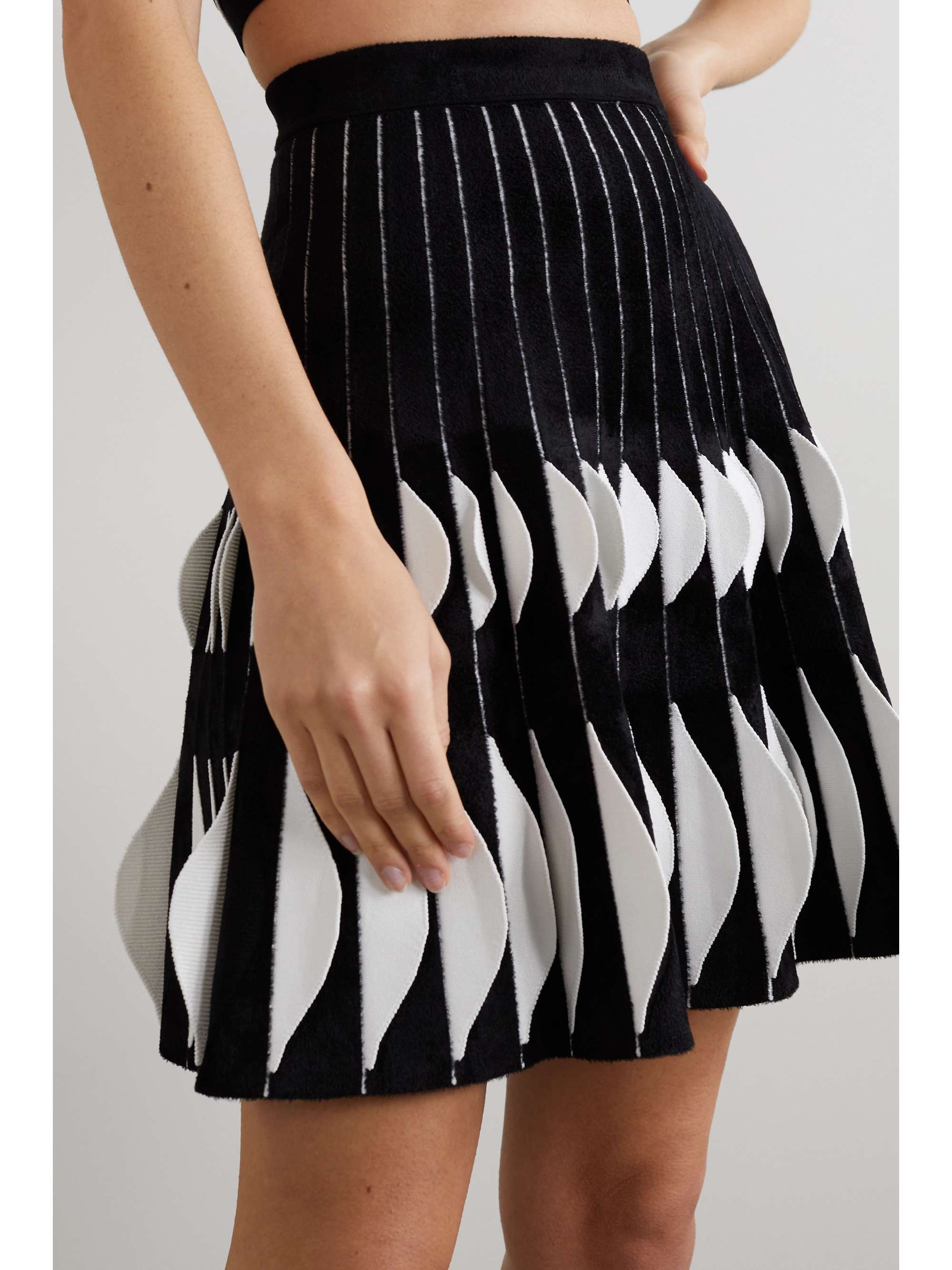 ALAÏA Pleated velour and stretch-knit mini skirt