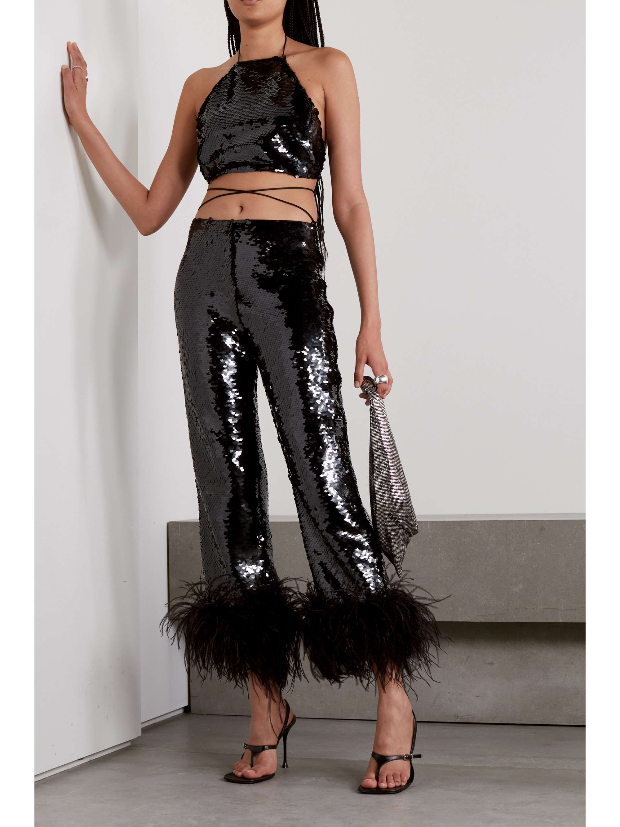 Magda Butrym has created the ultimate party pants. Made from chiffon, they're amplified with a drenching of sequins and fanciful feather trims. Turn heads and wear yours with the label's matching sequin top and heels.