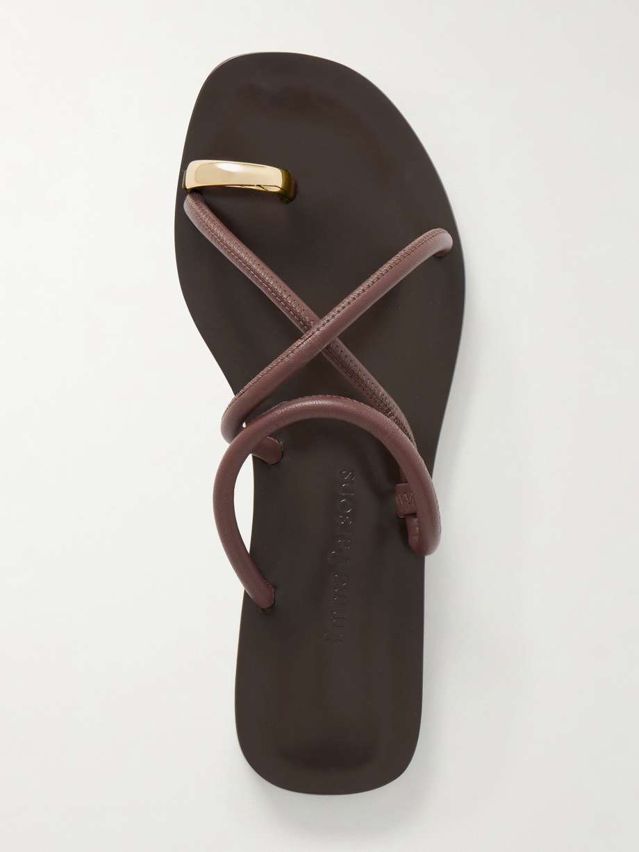 Emme Parsons' 'Laurie' sandals have slender leather straps that can be worn at the back of your heel like a slingback or over the foot as a slide. Handmade in Tuscany, they have lightly cushioned footbeds for a comfortable step. Complement the sleek gold-tone toe ring with a dainty anklet.
