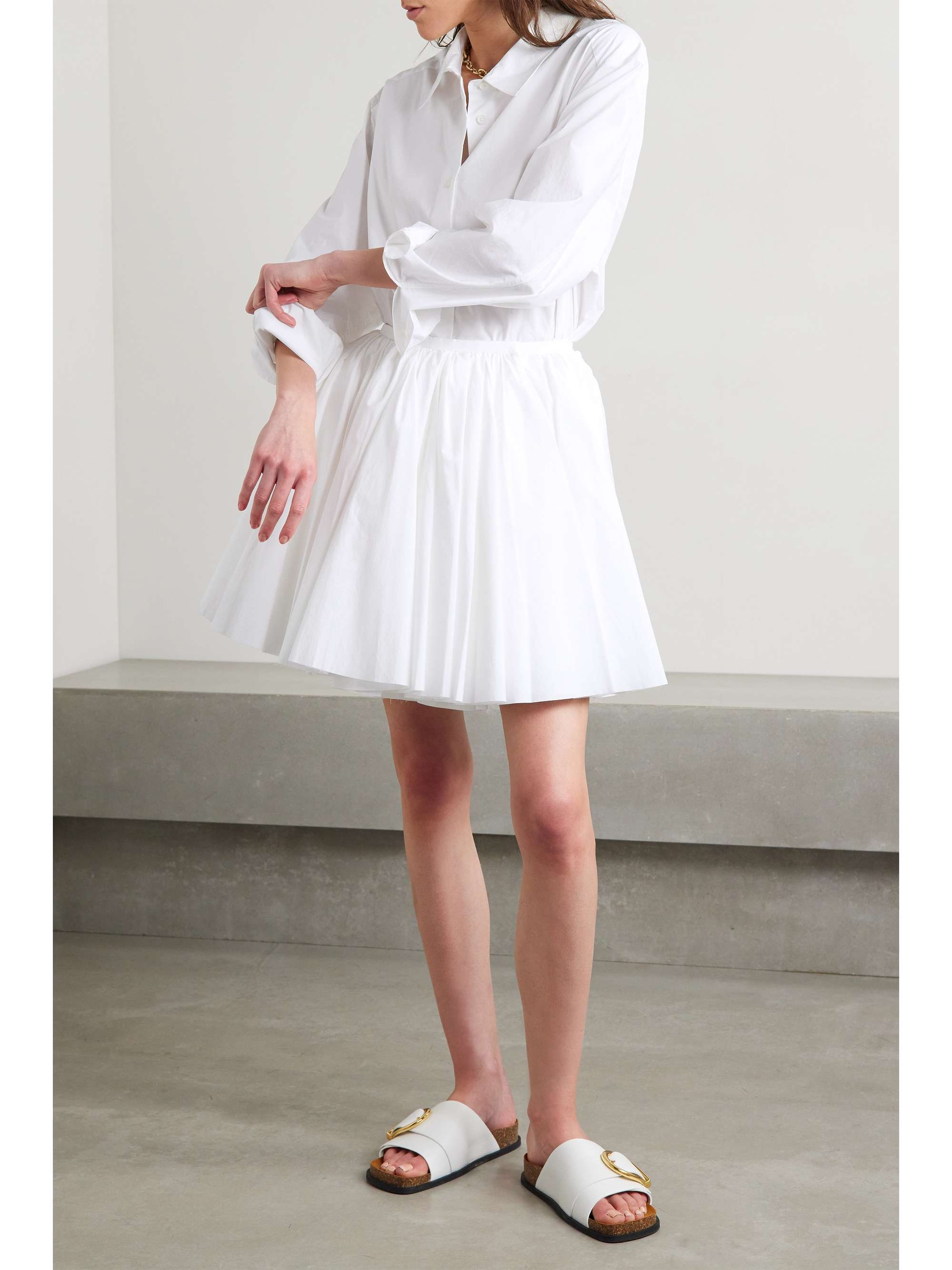 KHAITE Jorja layered pleated cotton-poplin mini wrap skirt