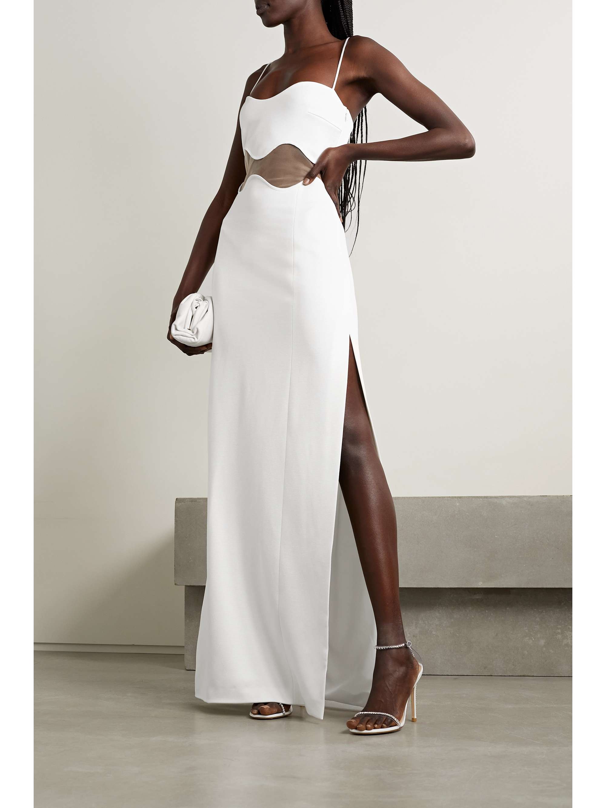 Galvan's 'Isola Bella' dress is a perfect option for all pre-nuptial events. Designed for a close fit, it's made from knitted fabric and has a center cutout with a beige mesh overlay. The barely-there straps frame the romantic sweetheart neckline beautifully.