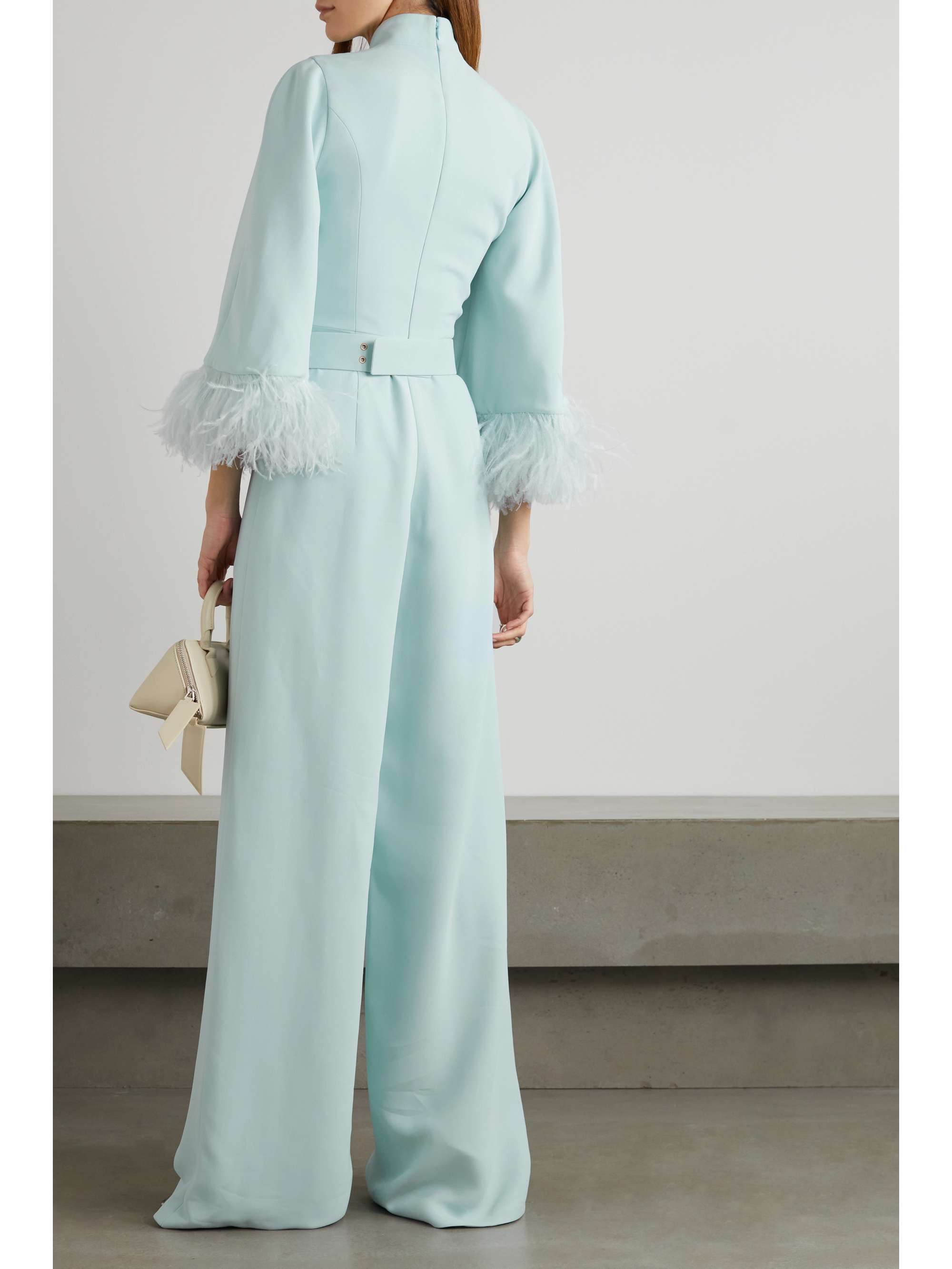 ANDREW GN Belted feather-trimmed embellished crepe jumpsuit