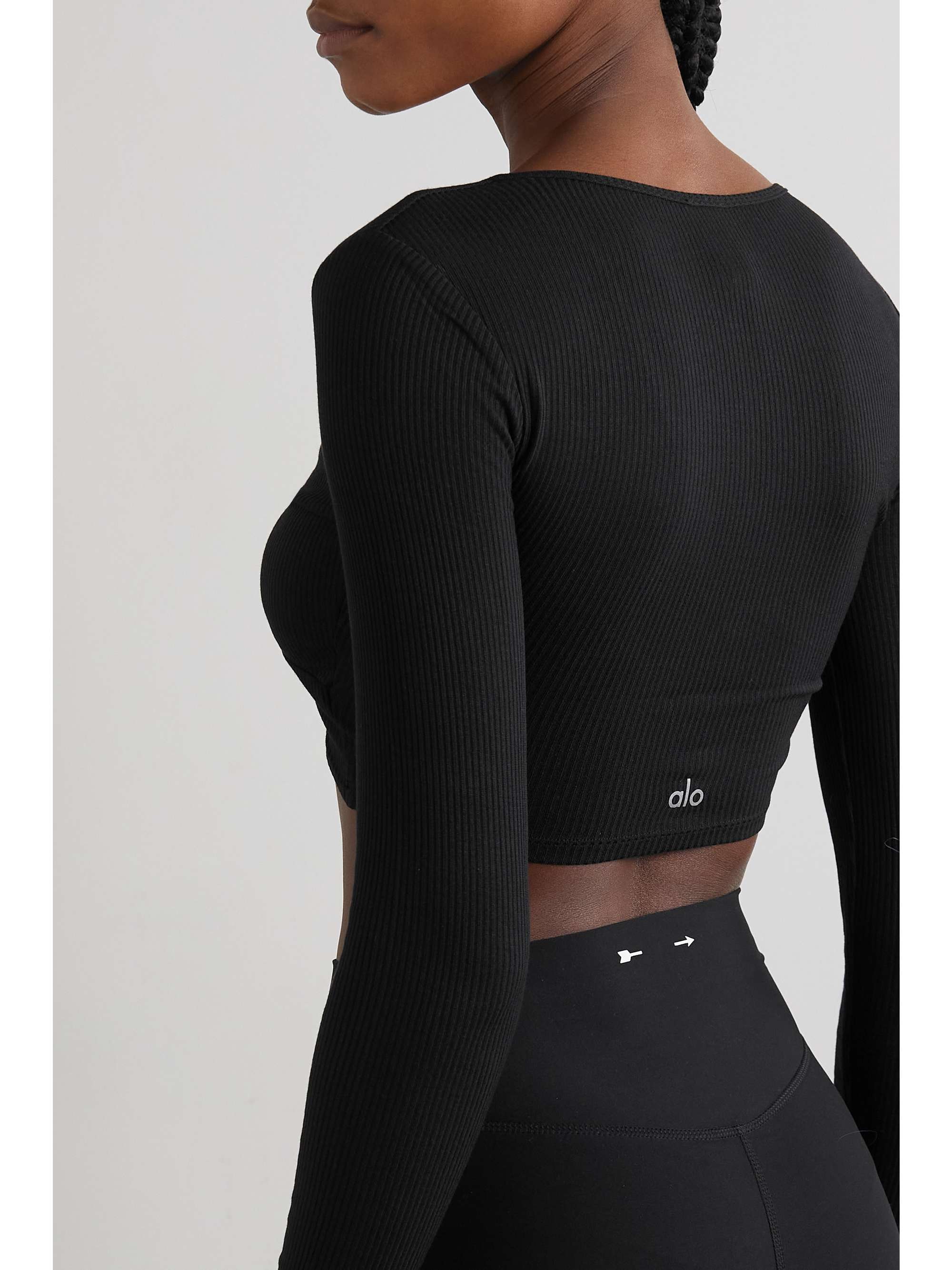 ALO YOGA Cropped knotted ribbed stretch-modal top