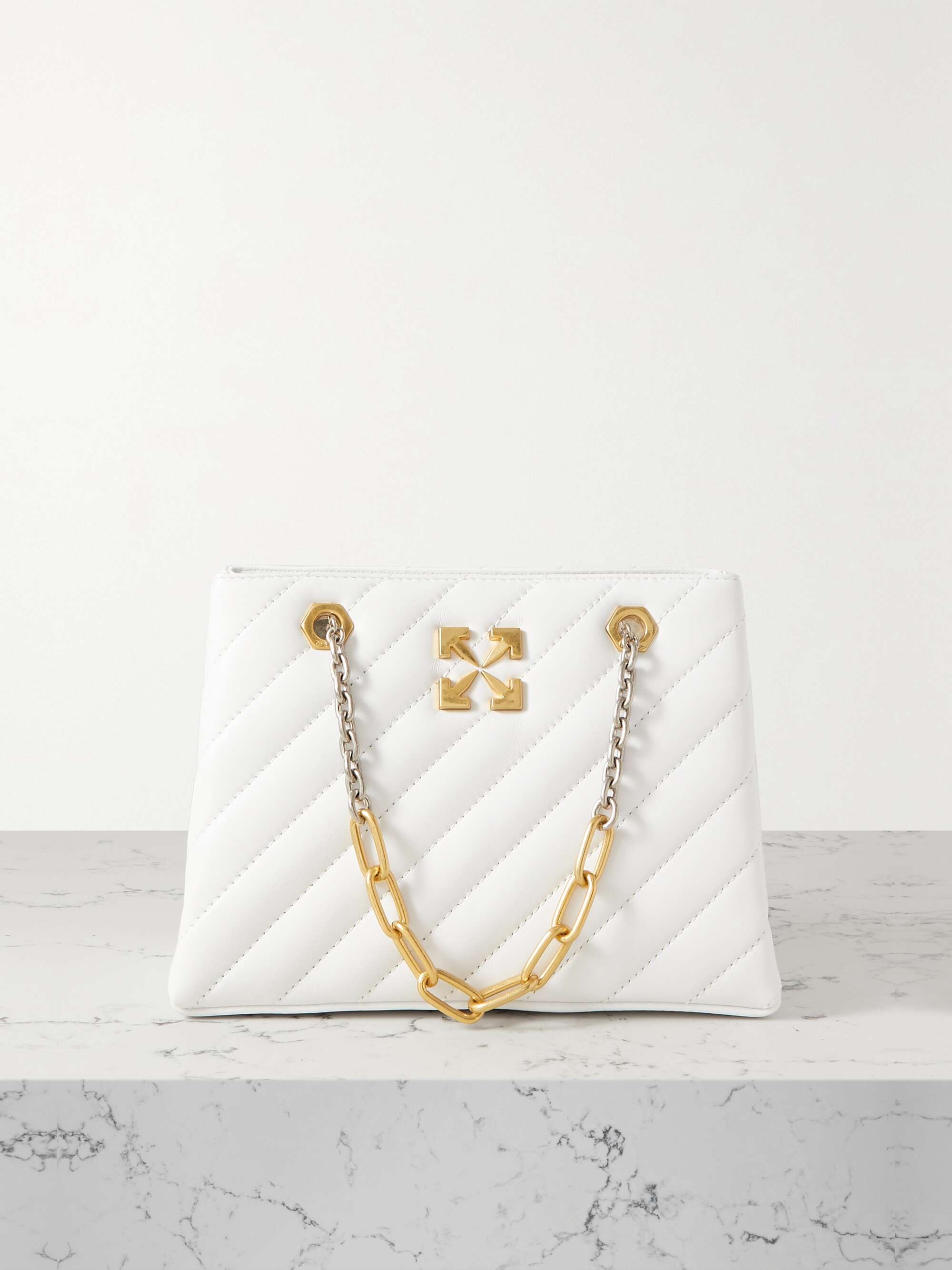 white purse with gold chain