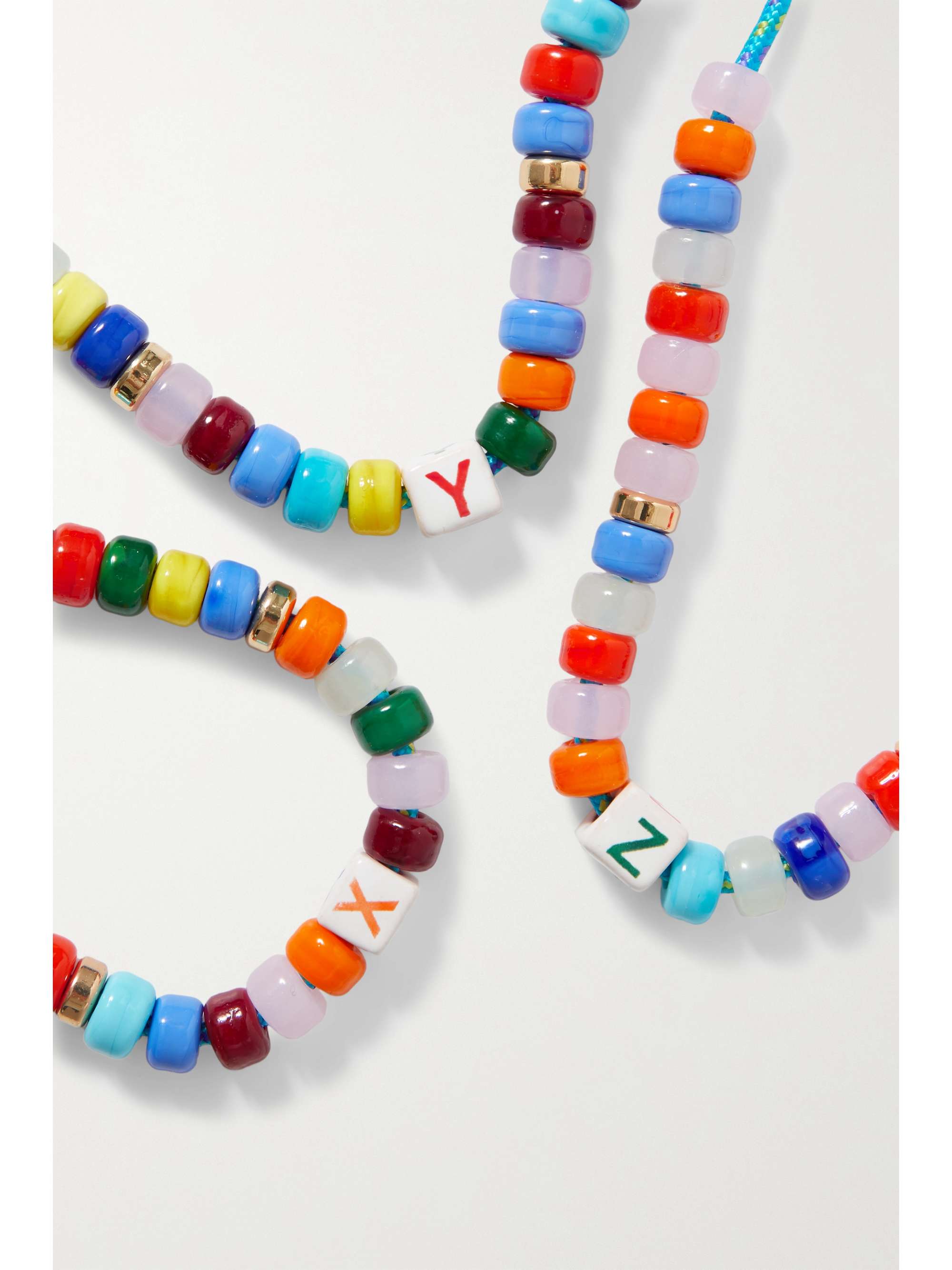 ÉLIOU Buzio cord, bead and gold-plated necklace