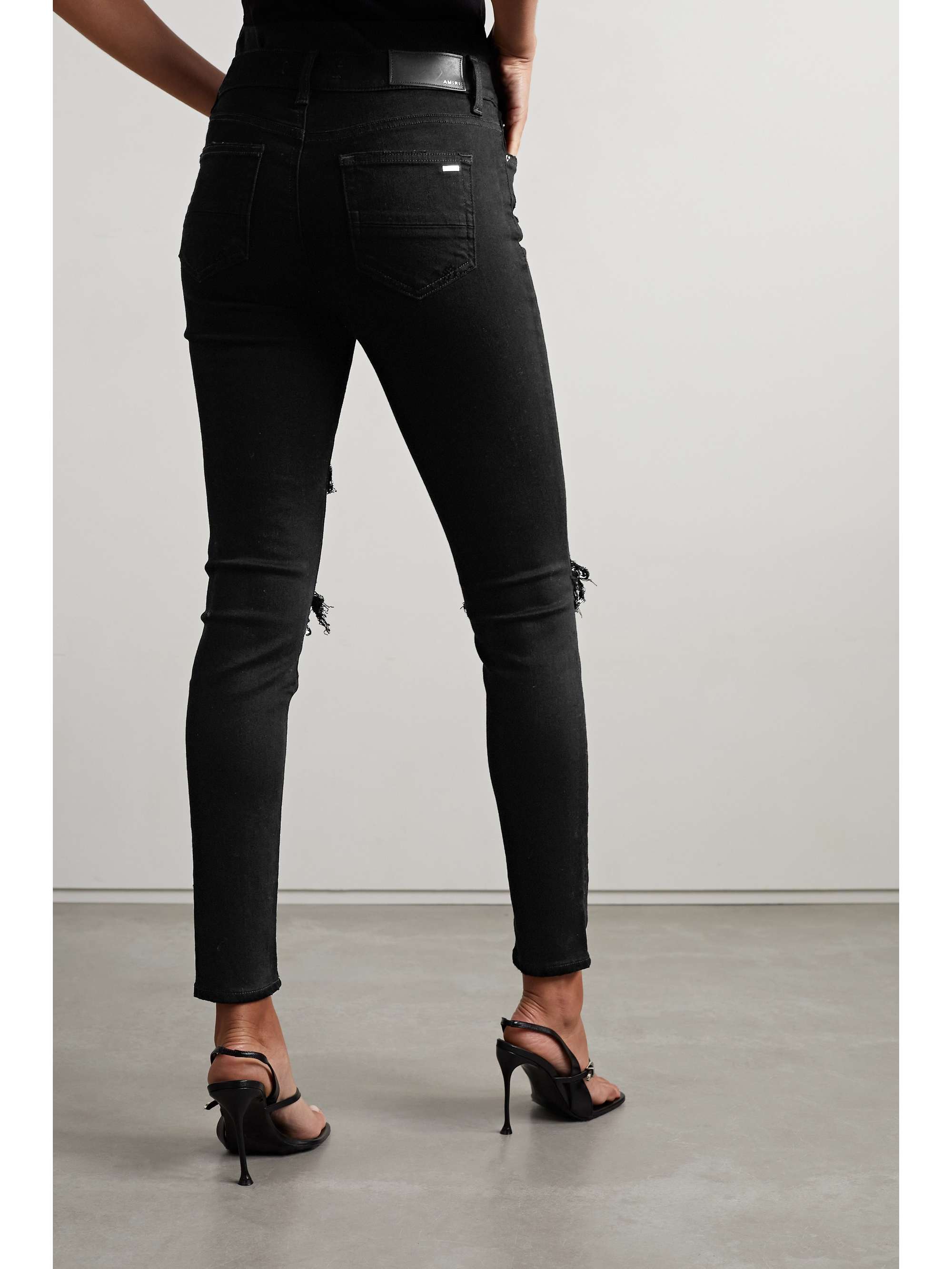 AMIRI MX1 leather-trimmed distressed high-rise slim-leg jeans