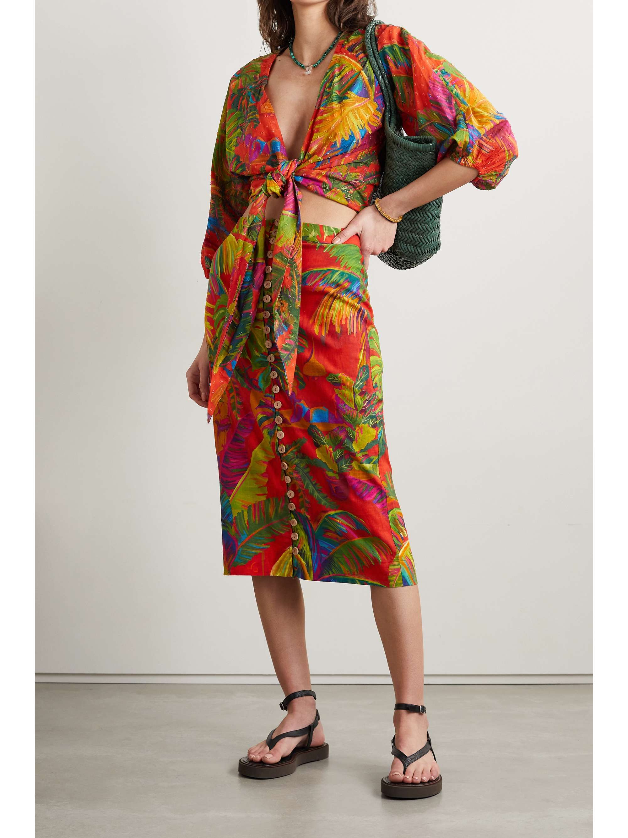 brightly coloured tie-front top cut for a loose fit from breezy fil coupé cotton and printed with a colorful pattern the brand calls 'Urban Jungle'. £/4 length sleeves with elasticated cuff and low neck tie front cropped fit. 