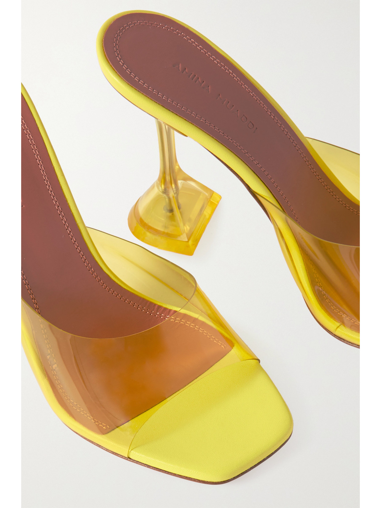 Shop Amina Muaddi Lupita Glass Pvc And Leather Mules In Yellow