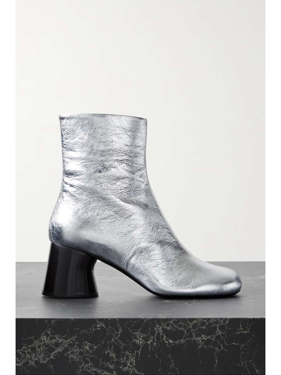 From the Pre-Fall '22 collection, Khaite's 'Admiral' ankle boots have been made in Italy from silver crinkled-leather for an unexpected yet versatile style. They're set on sculptural 45mm heels and have rounded toes. Wear yours with anything from denim to patterned dresses.