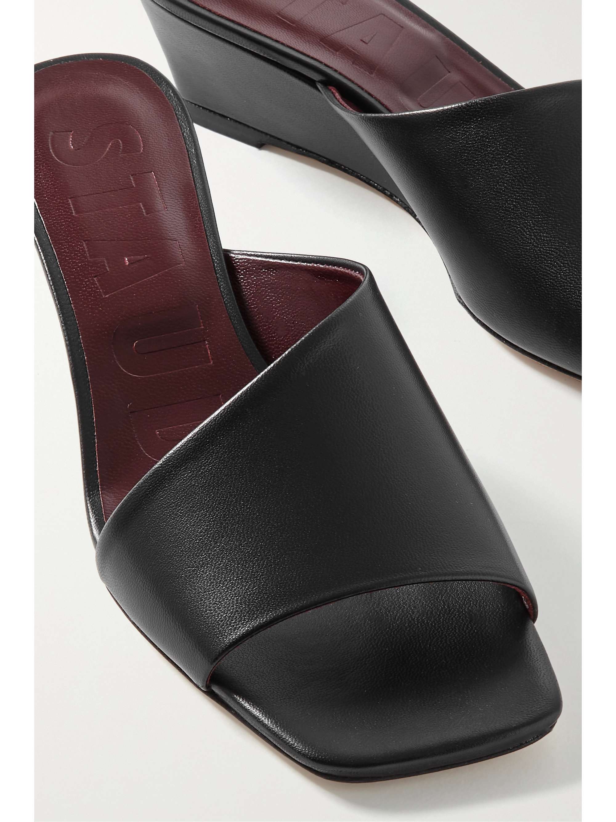 STAUD Nevil asymmetric leather wedge mules
