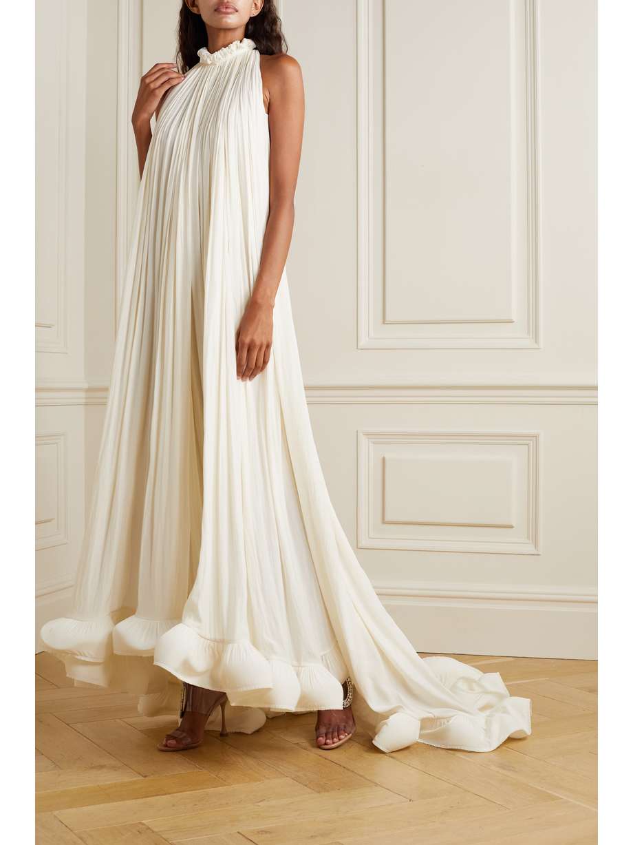 Inspired by a style from the heritage label's archives, Lanvin's entrance-making gown has a tumbling ruffled hemline that swishes dramatically as you walk. It's made from charmeuse in an off-white hue that will suit every complexion. Style yours with a low chignon and dewy lip.

