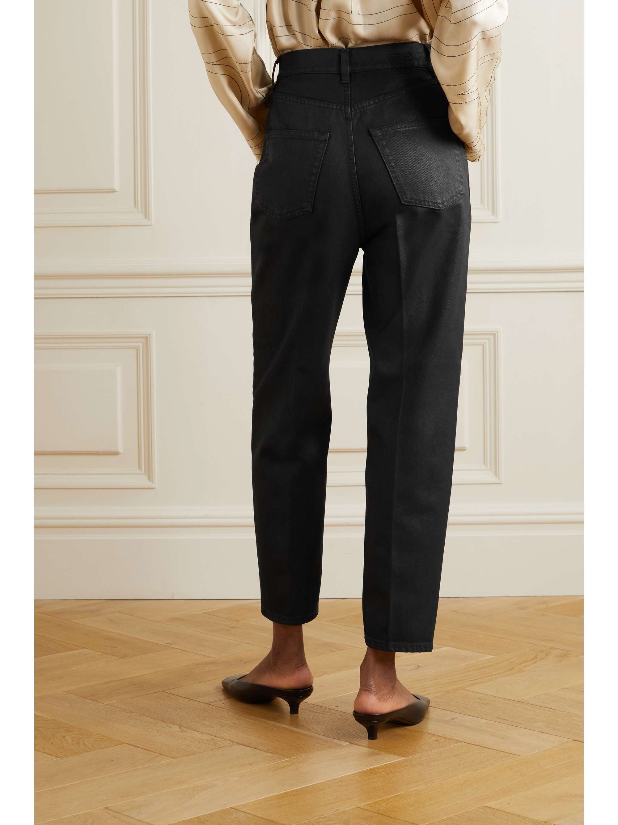TOTEME Coated high-rise tapered jeans