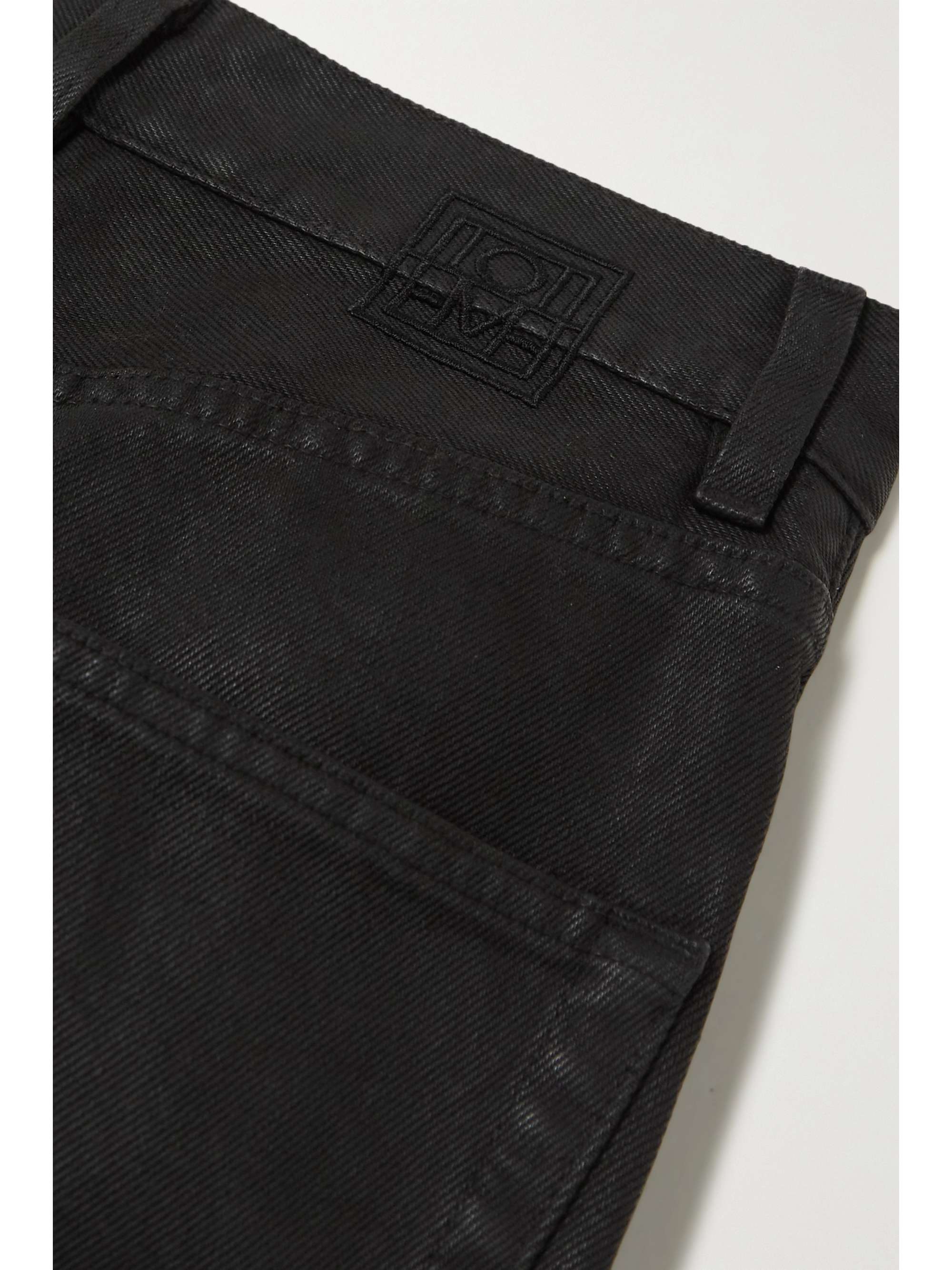 TOTEME Coated high-rise tapered jeans