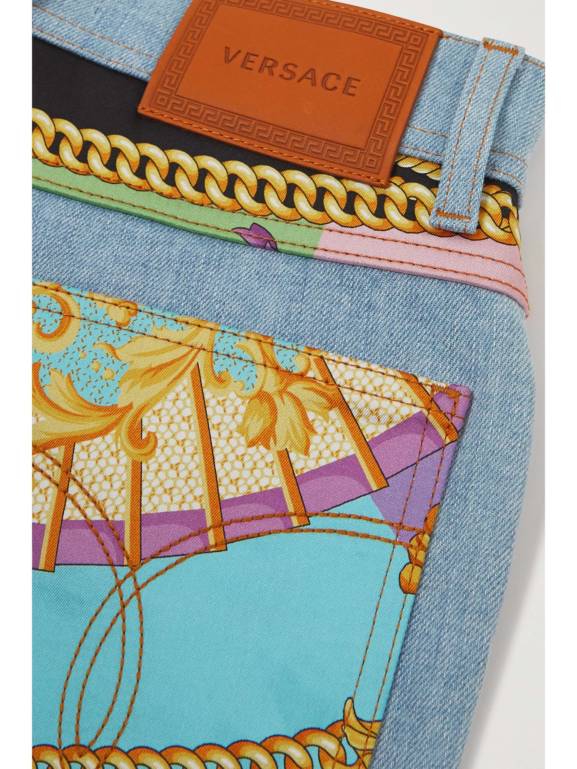 VERSACE Cropped printed twill-paneled mid-rise flared jeans