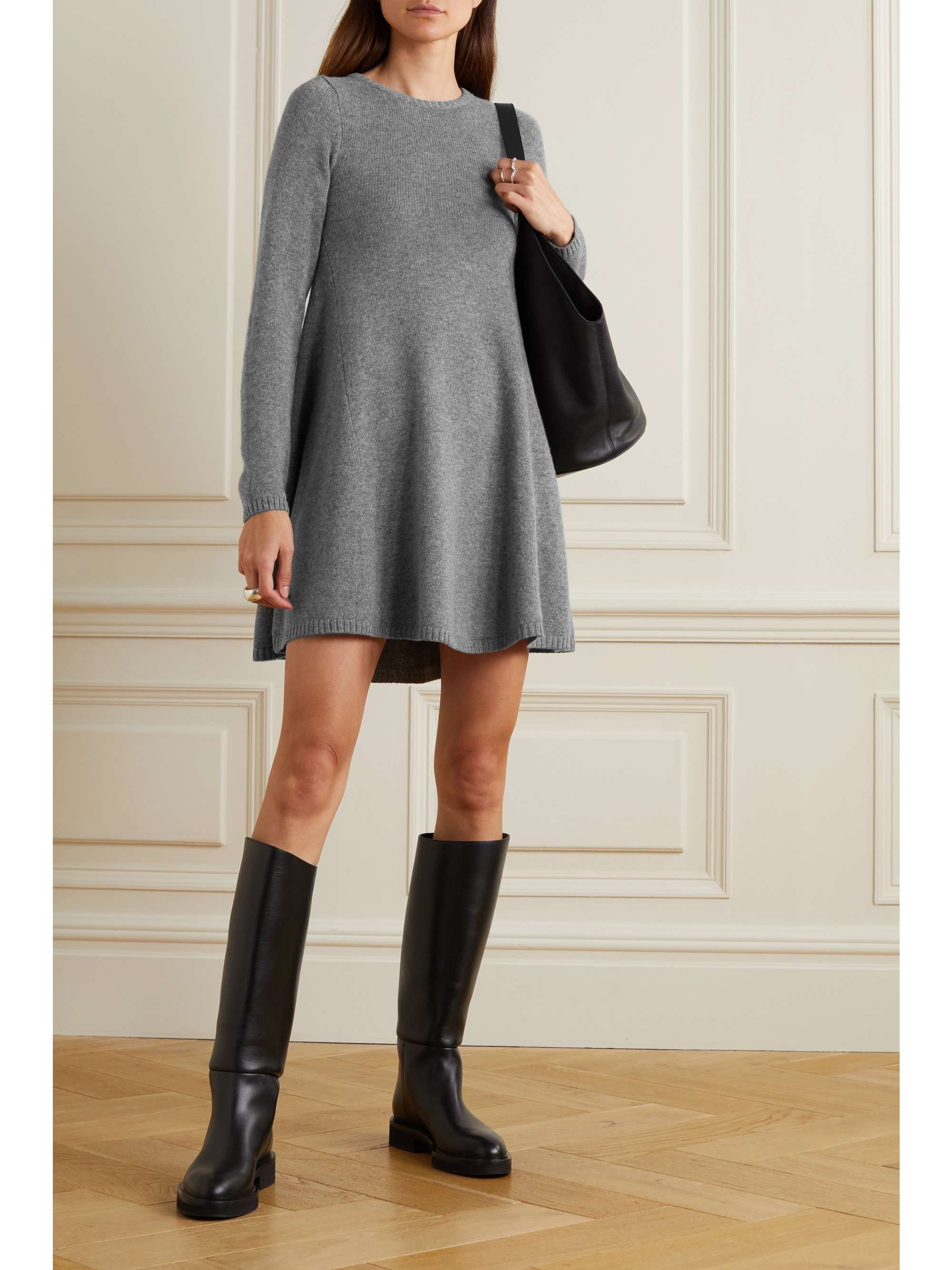 Grey knit dress with long sleeves and knee high black boots