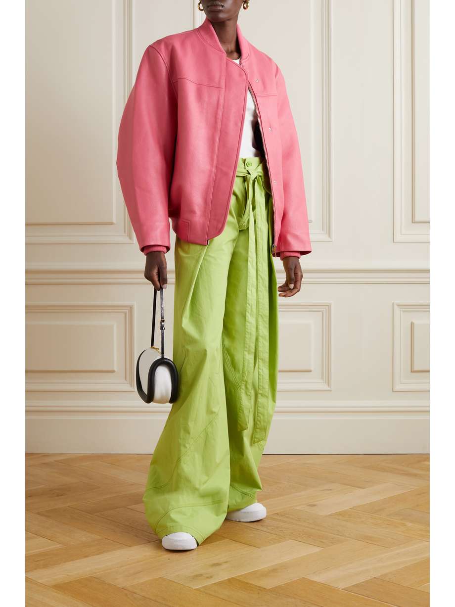 Cover the bomber jacket and hot pin k trends this AW22 in the 'Hot Pink' REMAIN Birger Christensen 'Maryan' bomber jacket. Cut for an oversized fit inspired by vintage finds, it's made from supple leather and has the style's signature ribbed trims. It has a front zip and popper buttons. This is a real stand out piece for transtioning into AW22. 