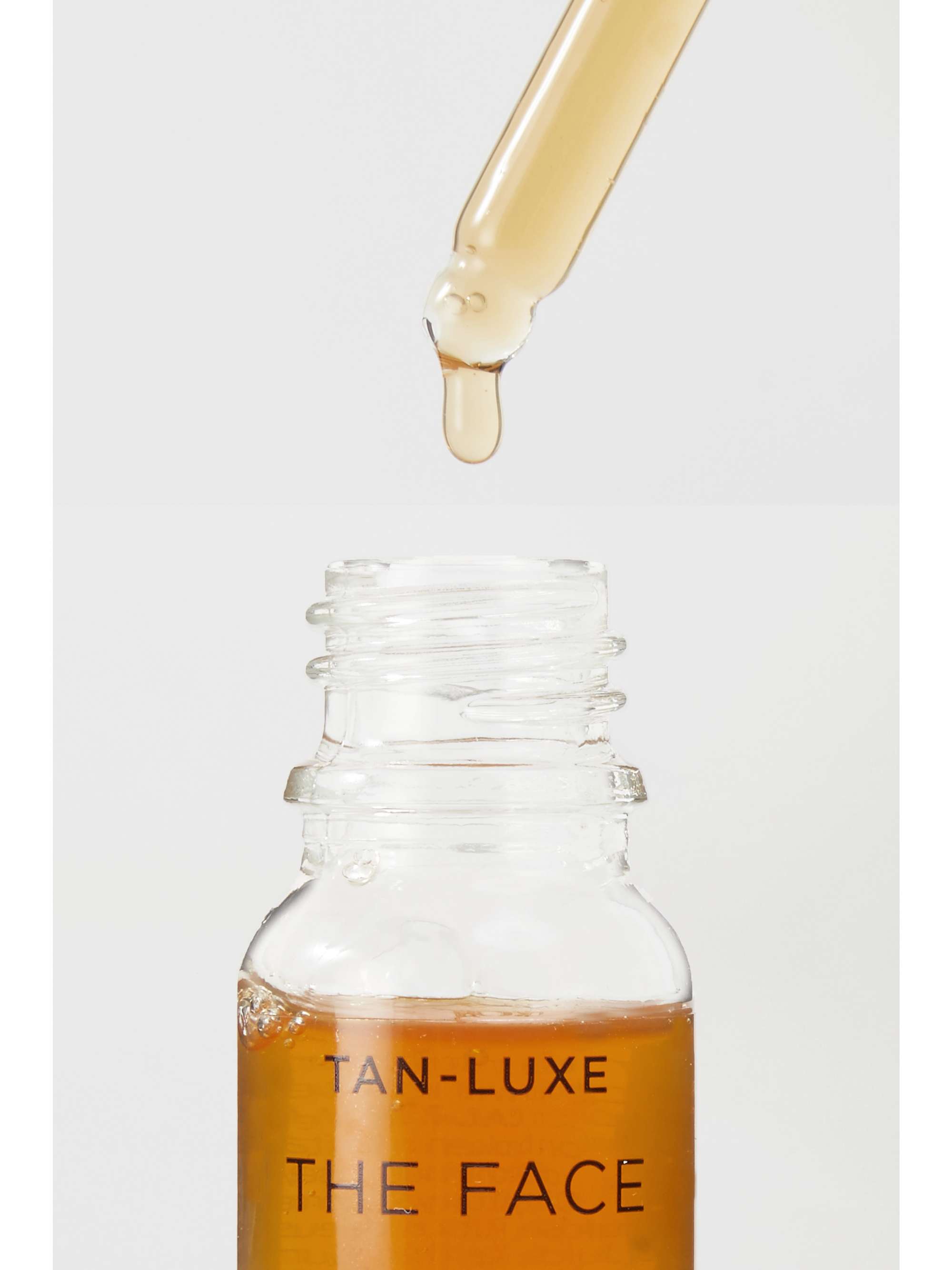 TAN-LUXE Gouttes autobronzantes illuminatrices The Face spécial fêtes, Clair/Moyen, 10 ml