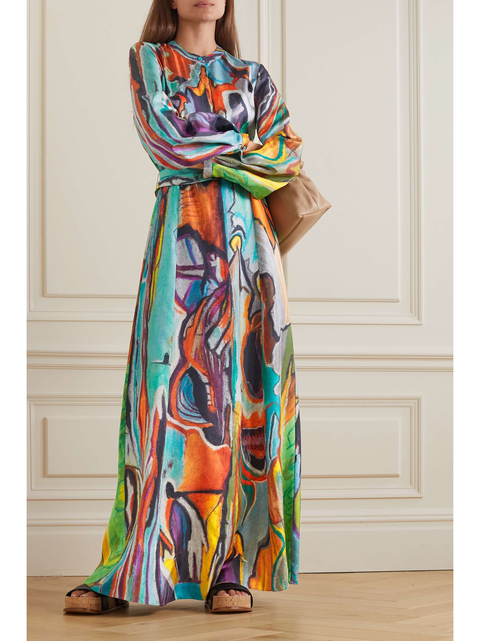 Gabriela Hearst's 'Massey' dress is printed in the label's colorful 'A Place Called Home' motif, inspired by Ana Martinez Orizondo's pastel drawings of a tree's life. It's cut from languid silk-twill and has subtle long-length puffed sleeves and a detachable belt to cinch the slightly loose shape. It is a maxi length and buttons to the waist under a hidden placket. 