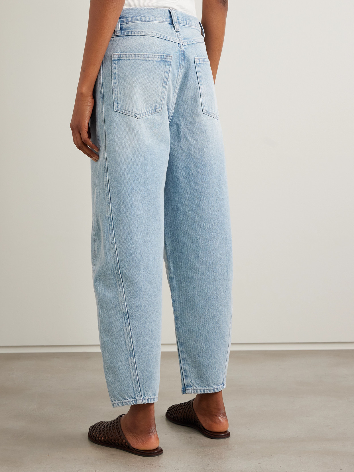 FRAME THE TWISTED PANELED HIGH-RISE STRAIGHT-LEG JEANS