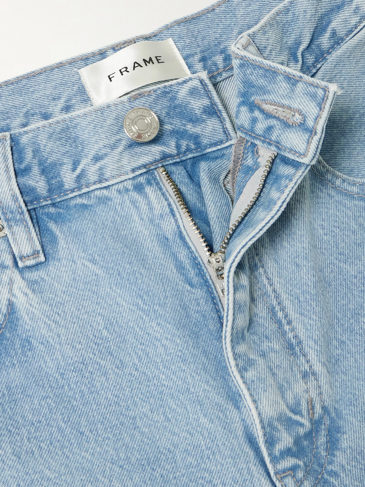 Shop Frame The Twisted Paneled High-rise Straight-leg Jeans