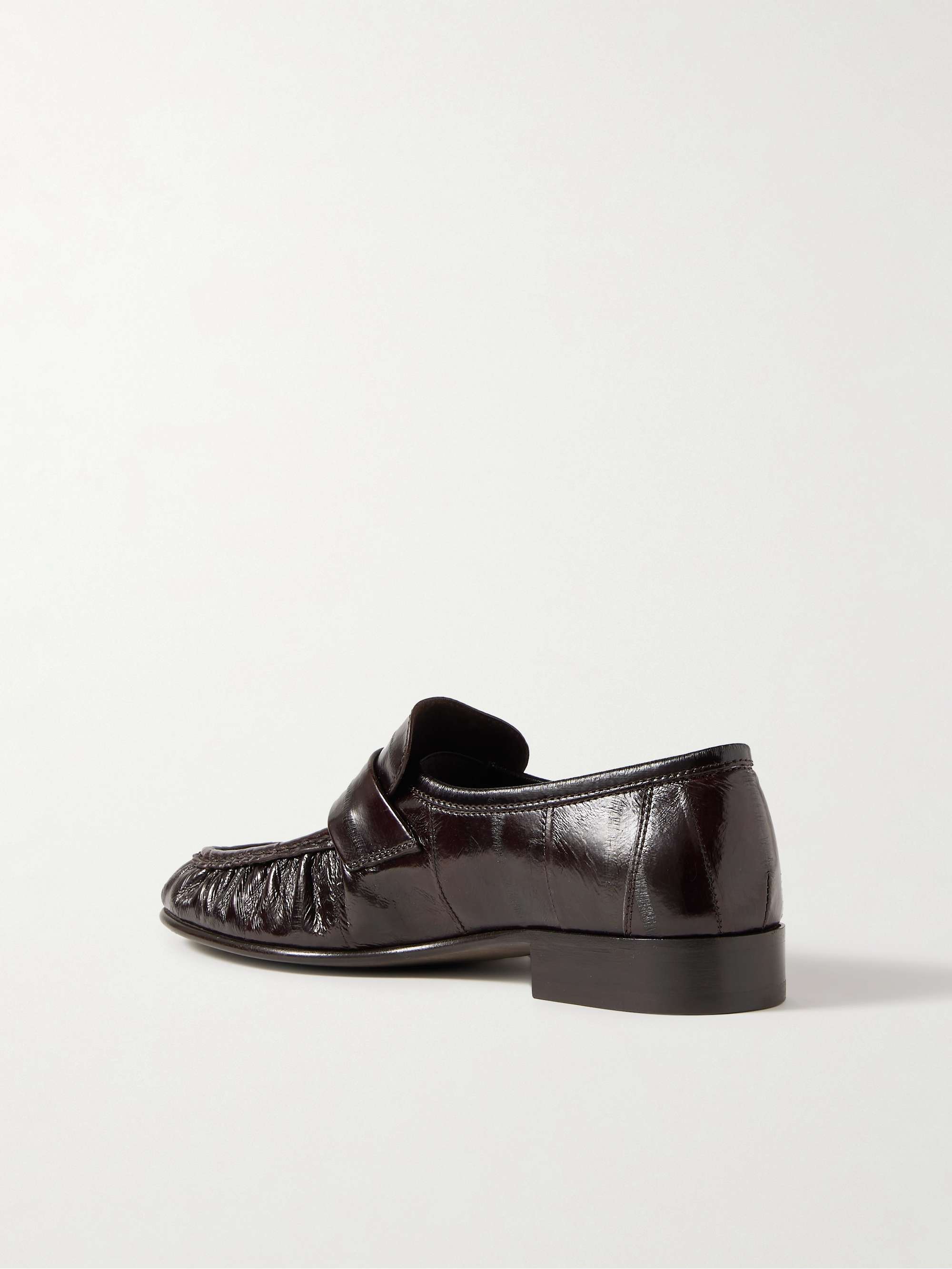 THE ROW Crinkled glossed-leather loafers