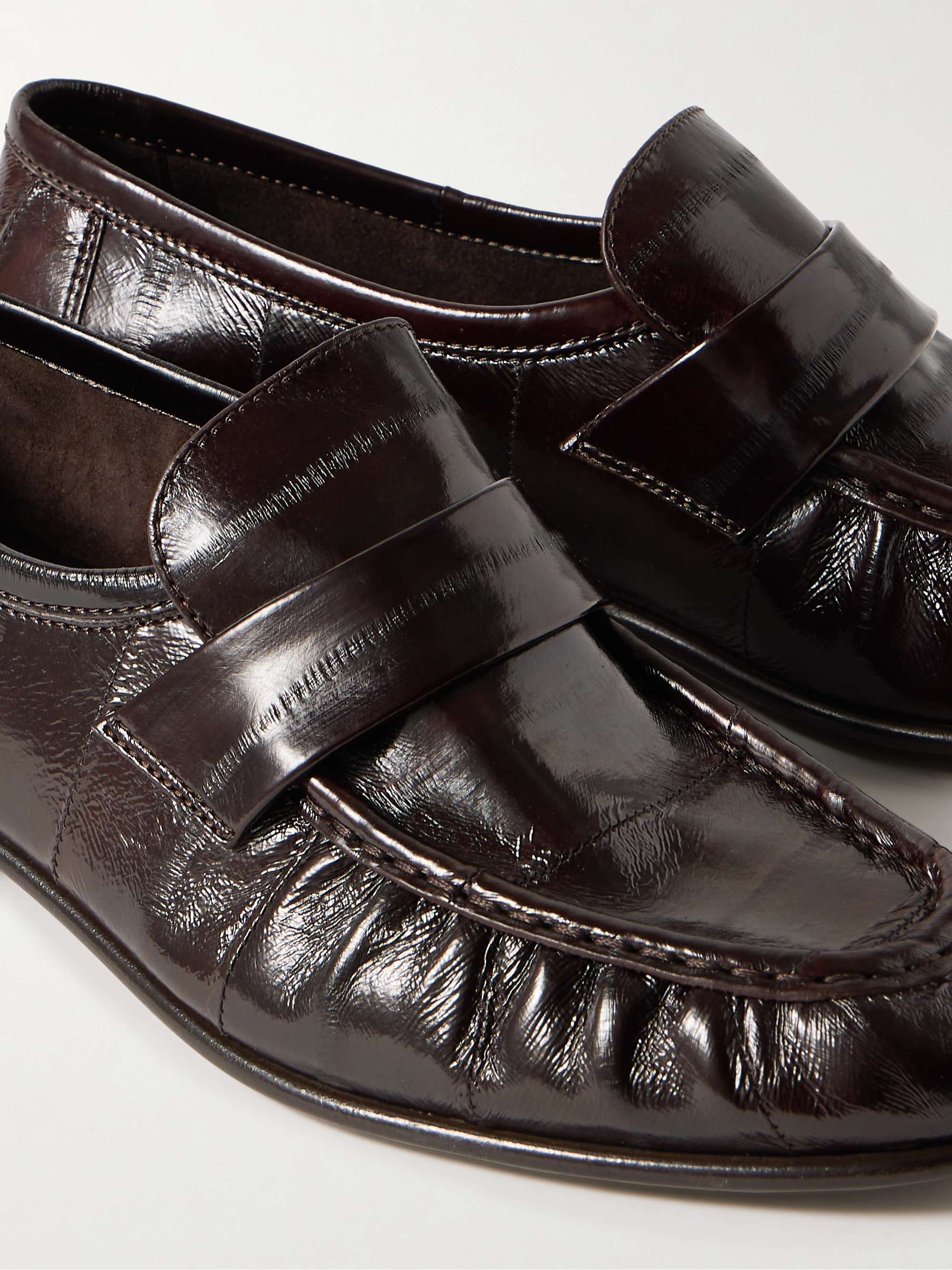 THE ROW Crinkled glossed-leather loafers