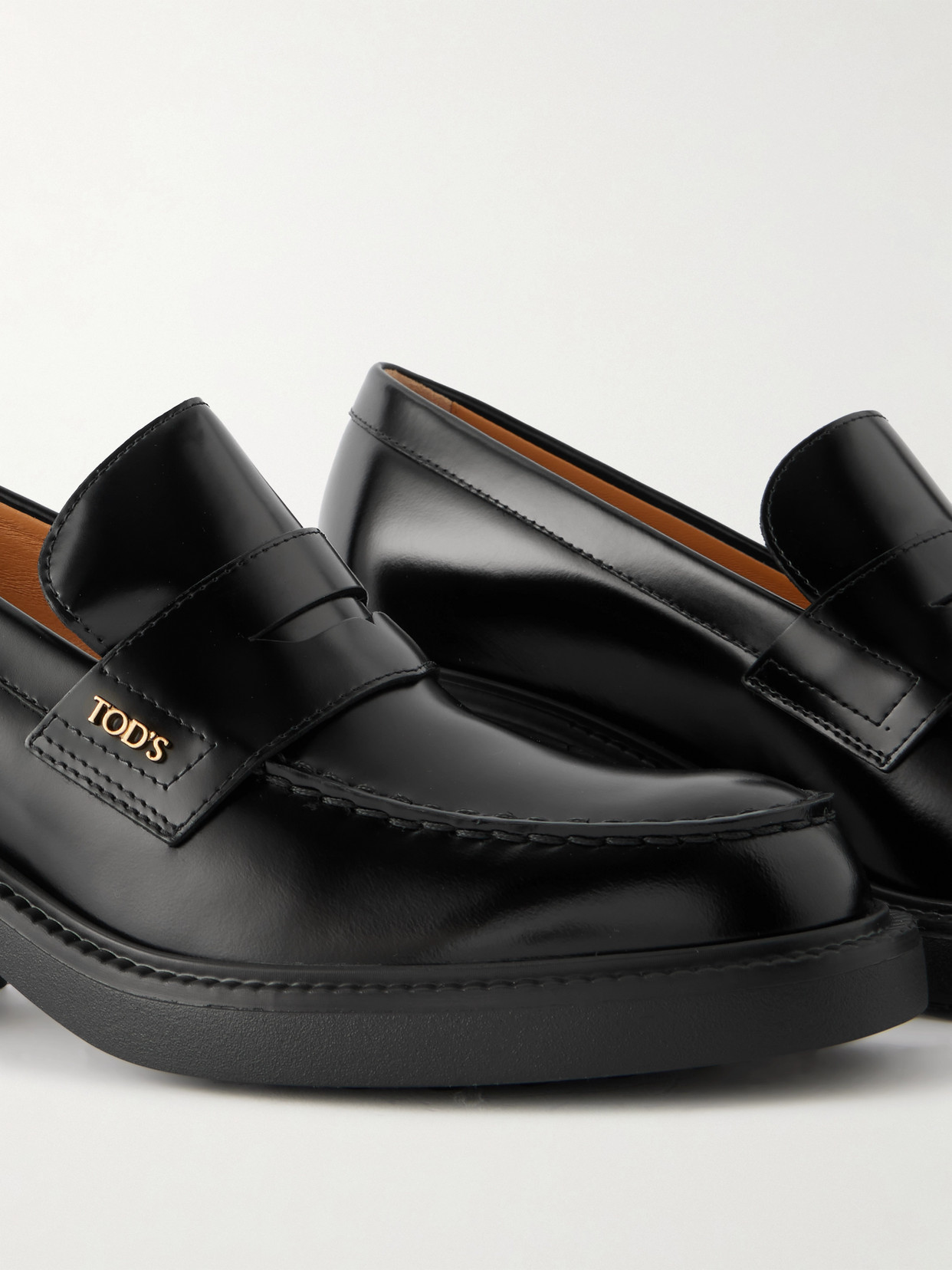 Tod's Black Loafers With Penny Slot And Logo Lettering On The Side In Black