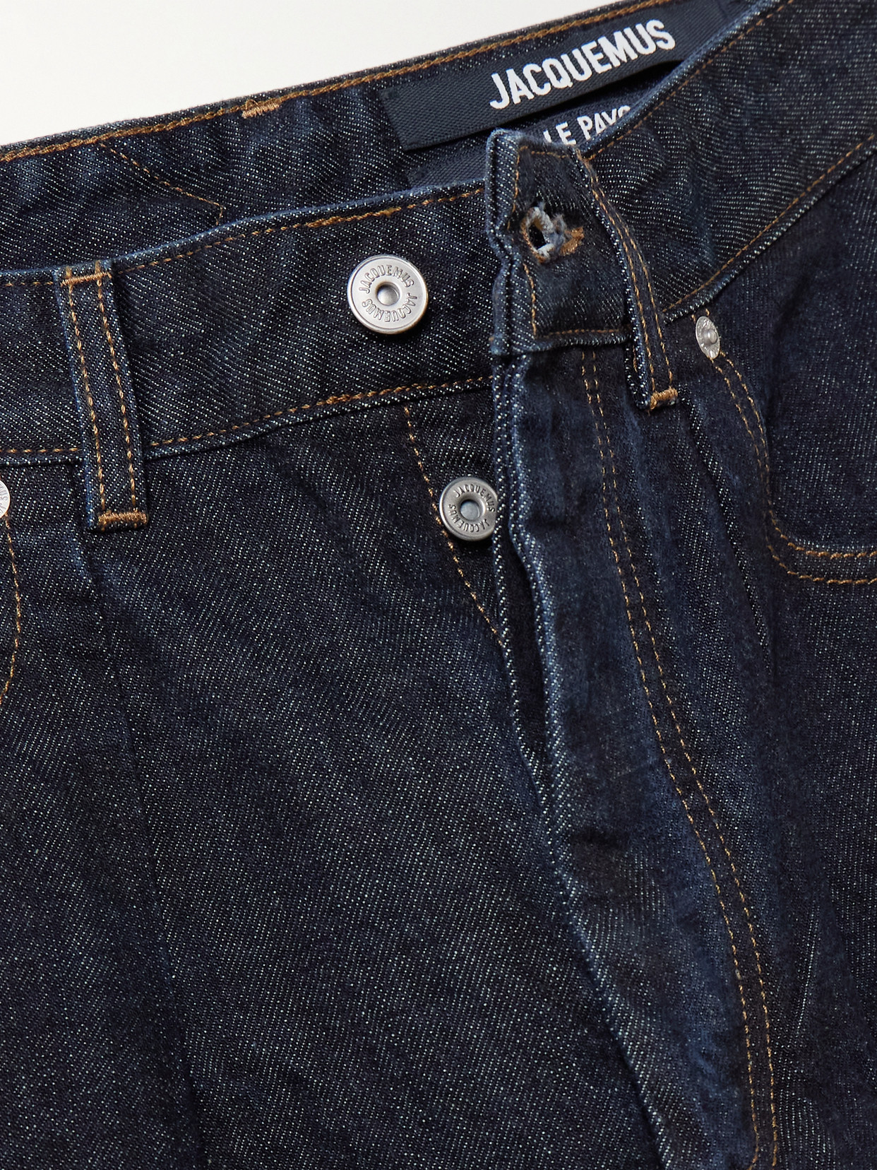 Jacquemus Curved Cut Ovalo Denim Pants In Blue