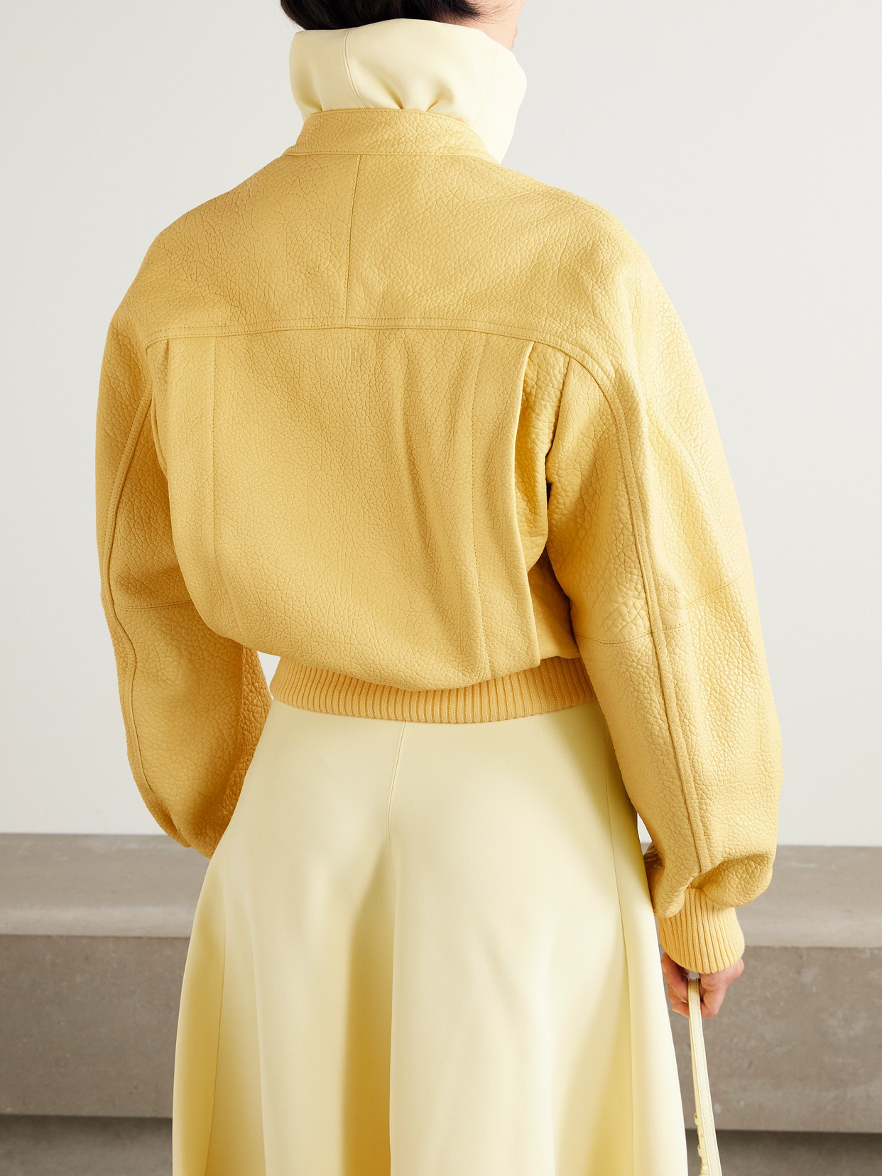 Jacquemus The Tore Cropped Textured-leather Bomber Jacket In Yellow