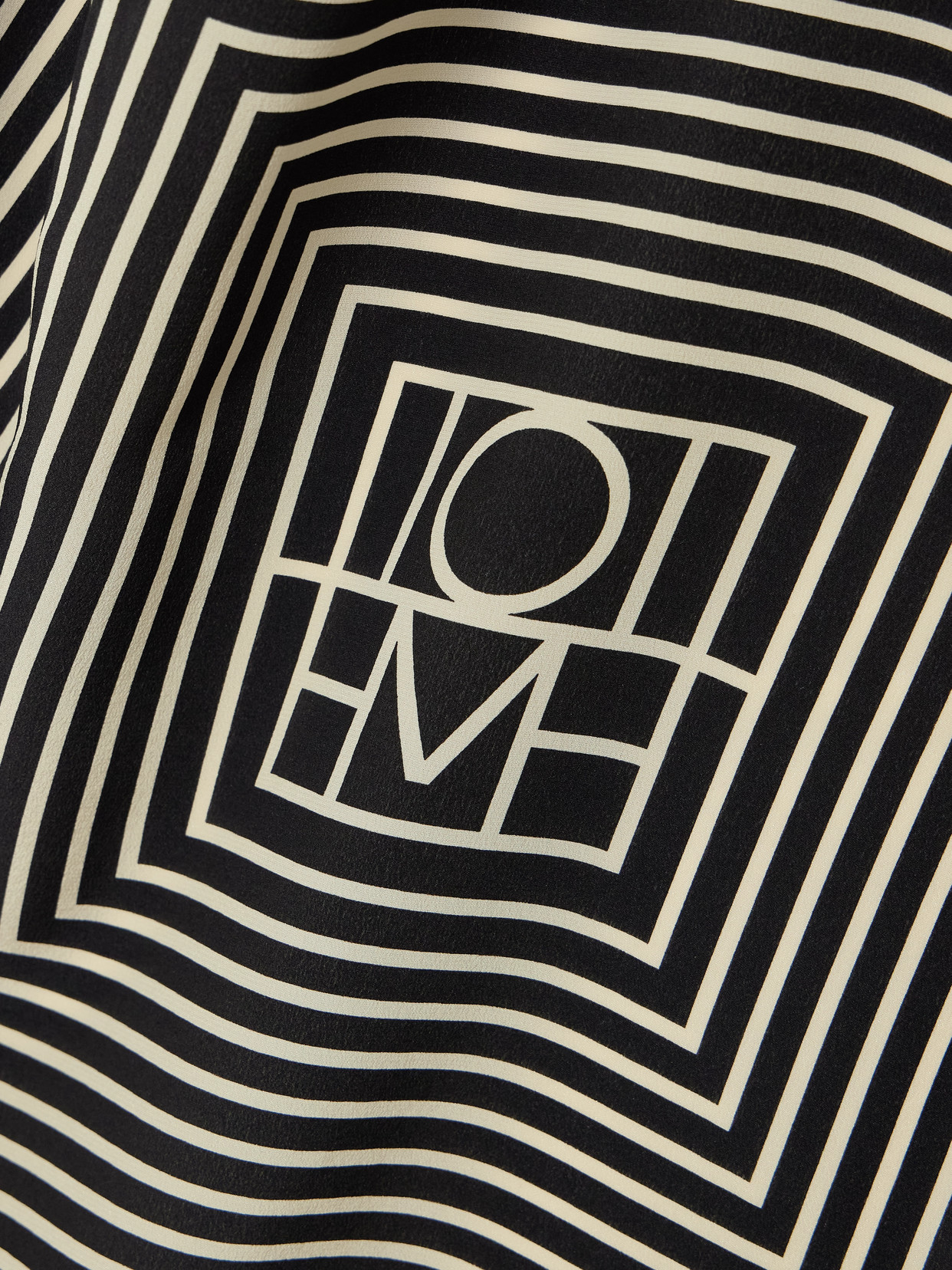 Totême Centered Monogram Silk Scarf In Black