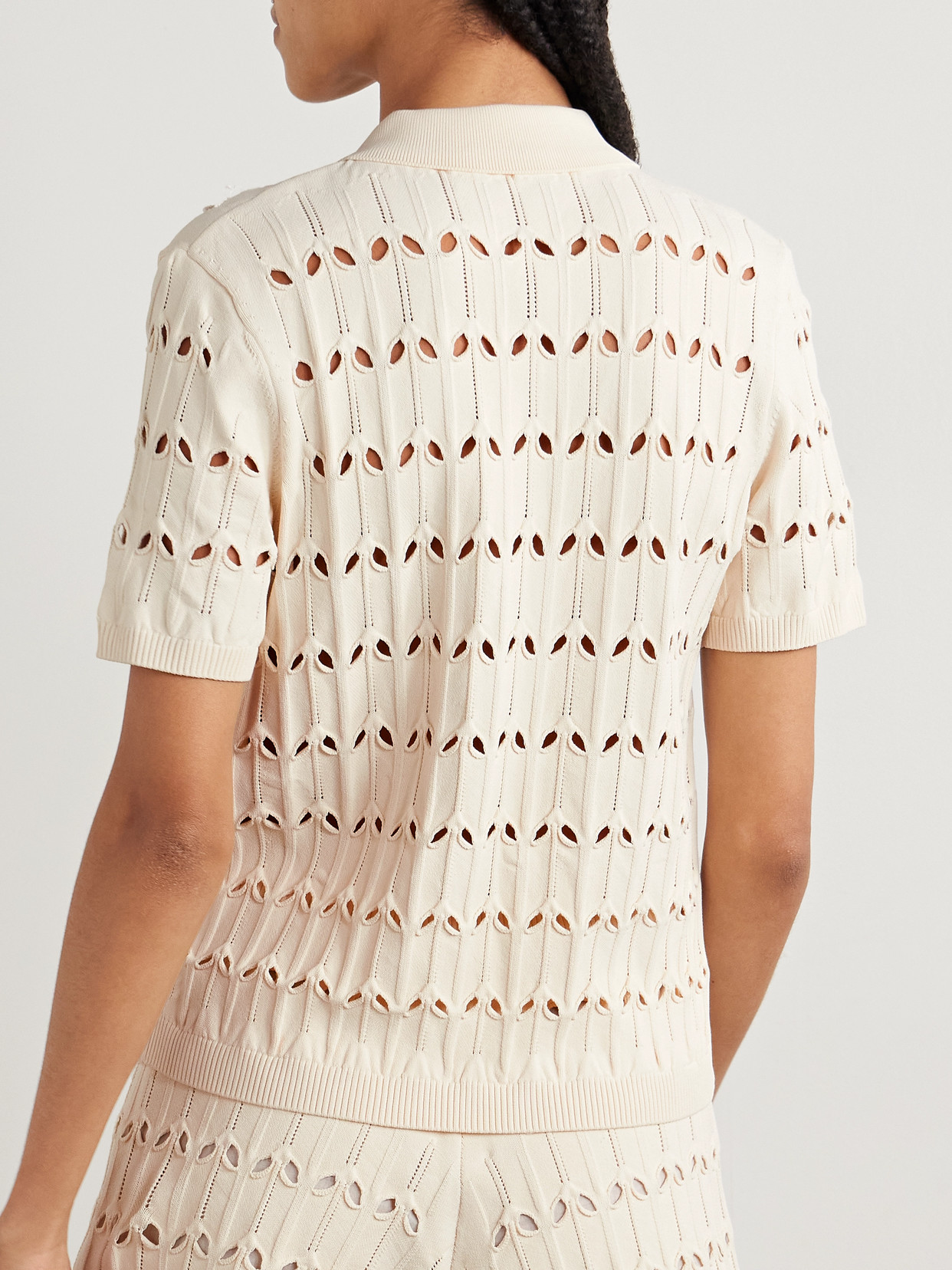 Zimmermann Rhiannon Cutout Pointelle-knit Polo Shirt In Cream