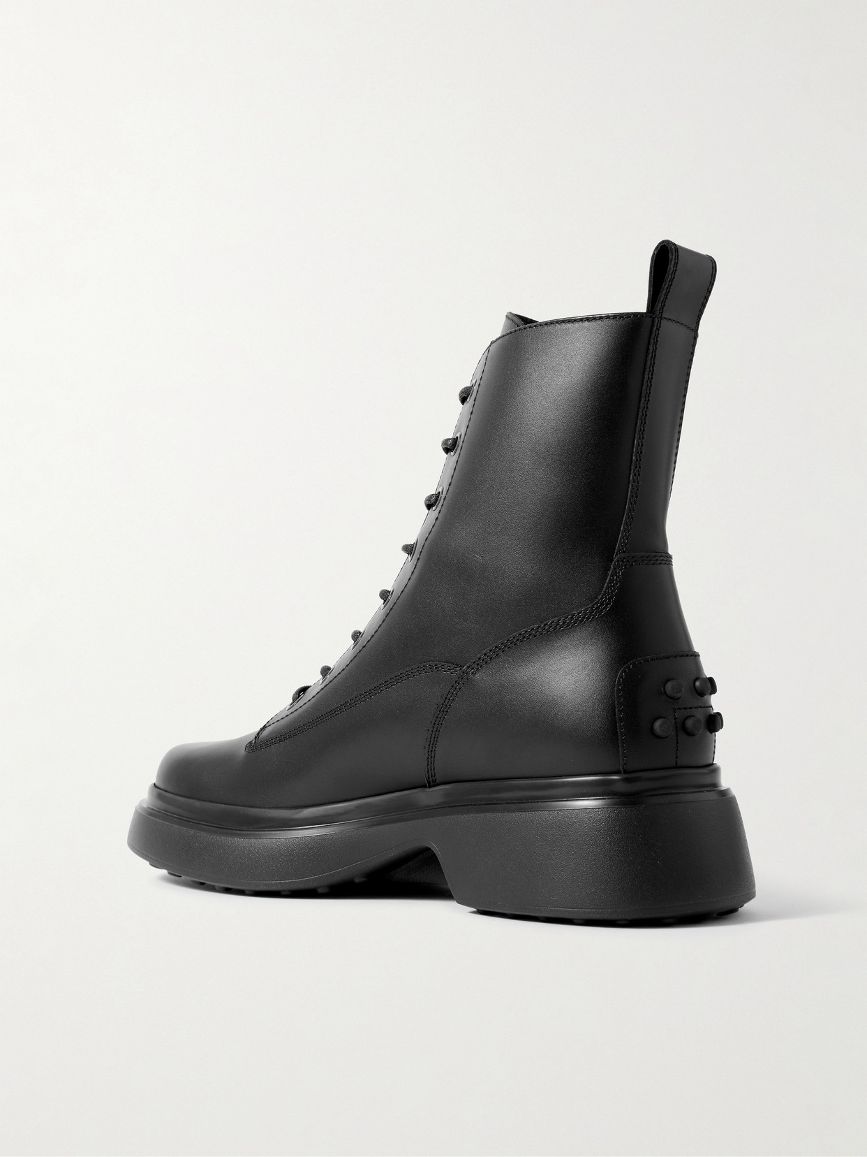 Tod's Chunky Sole Round Toe Ankle Boots With Pull Tab In Black