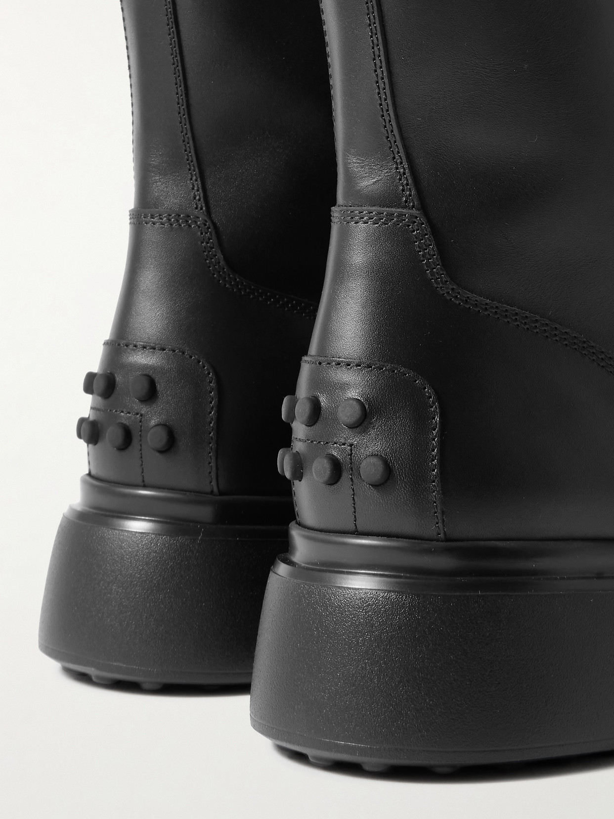 Tod's Chunky Sole Round Toe Ankle Boots With Pull Tab In Black