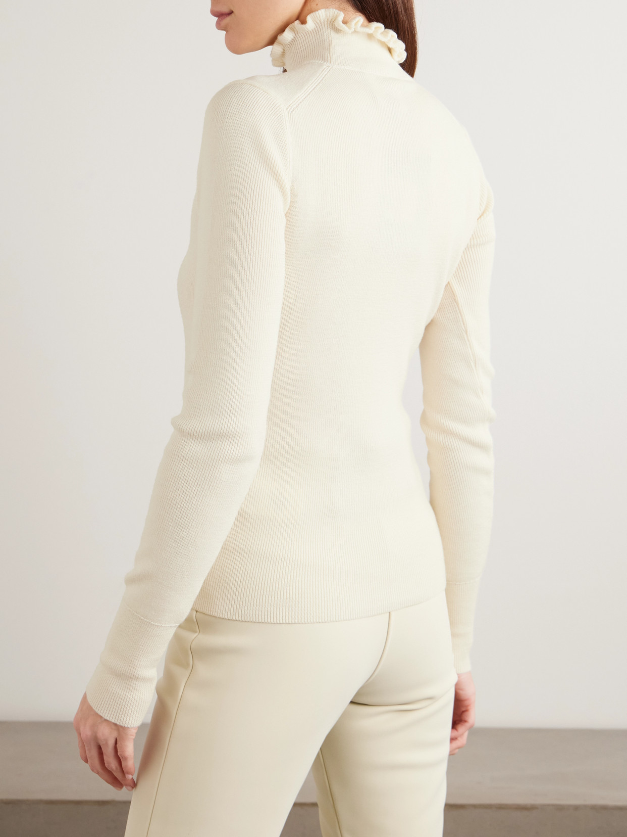 Cordova Kitz Ruffled Ribbed Merino Wool-blend Turtleneck Sweater In White