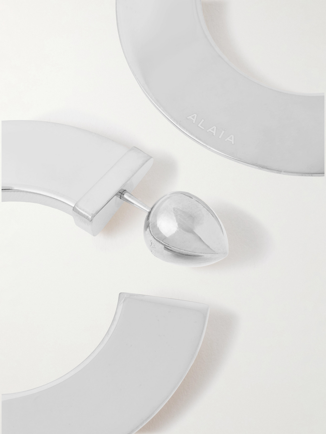 Alaïa Silver-tone Hoop Earrings In Metallic