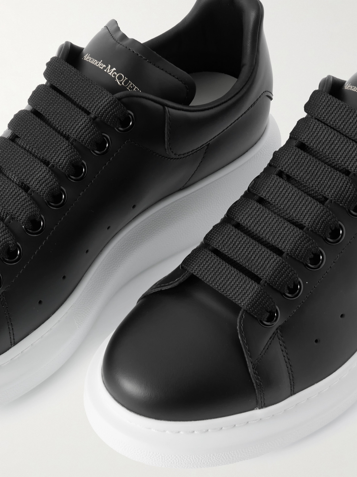 Alexander Mcqueen Women Black Low Top Sneakers With Logo Lettering On Tongue And Heel In Leather Wom