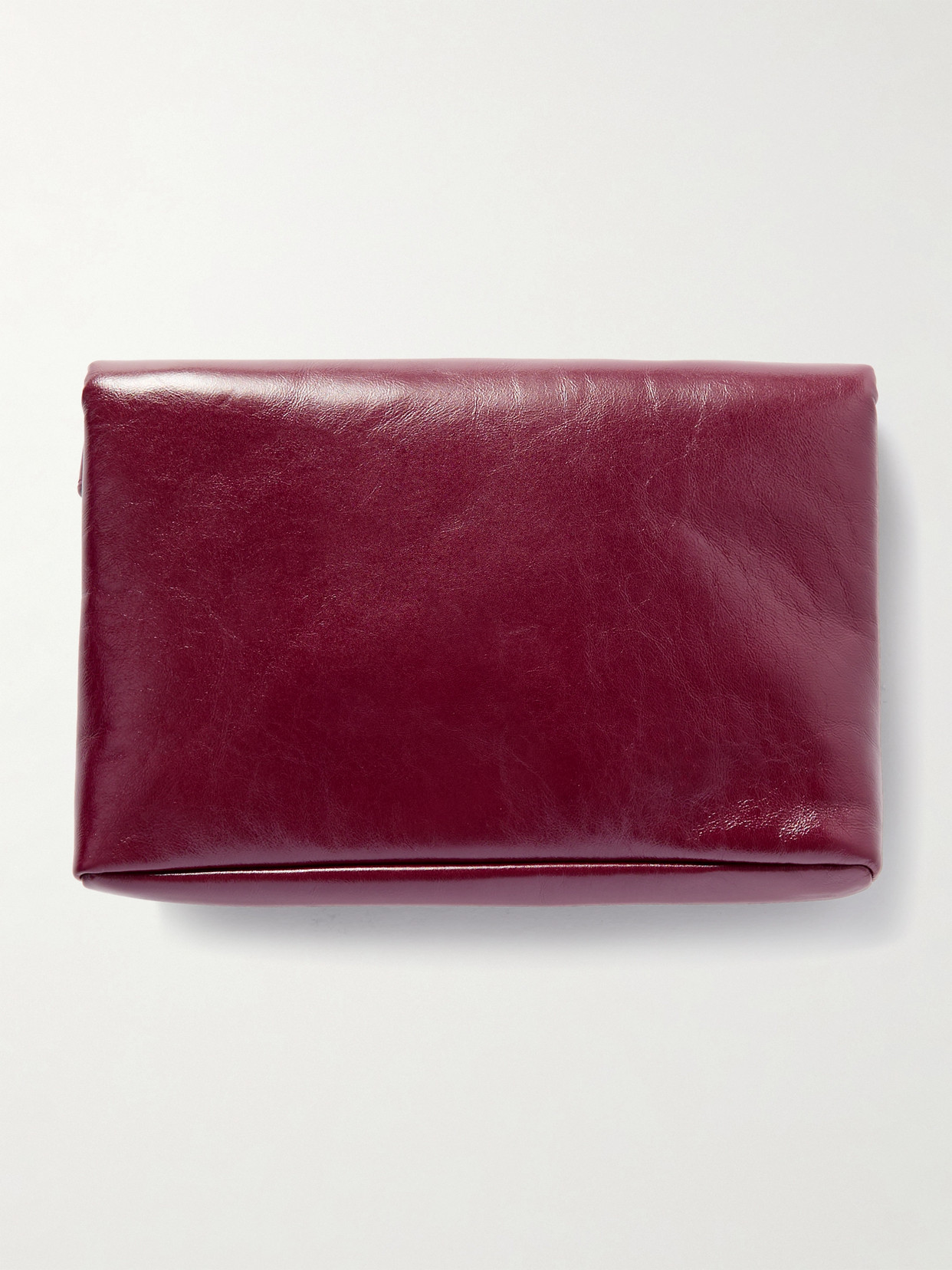 Saint Laurent Cassandre Large Glossed-leather Clutch In Red
