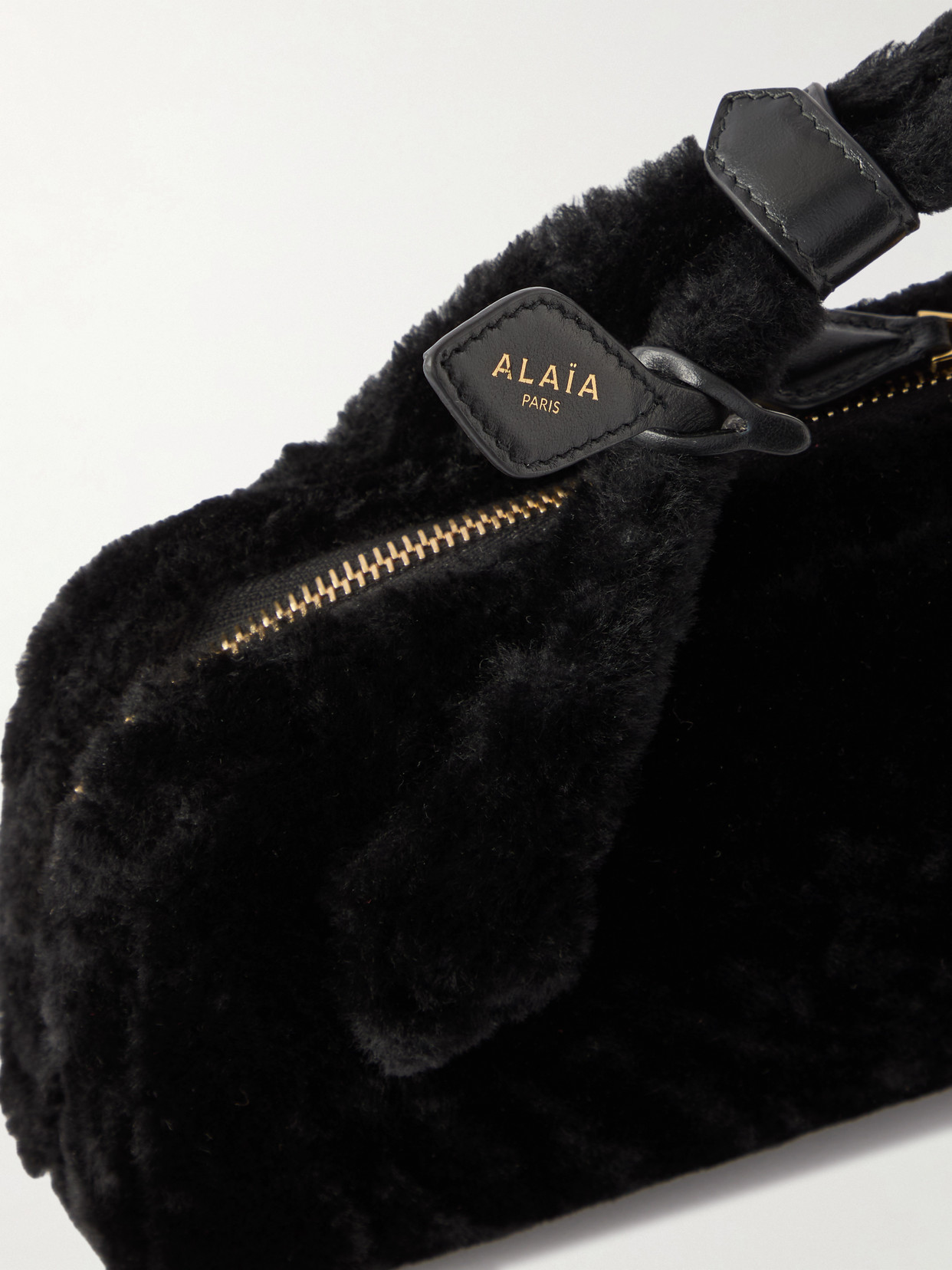 Alaïa Le Teckel Leather-trimmed Shearling Clutch In Black